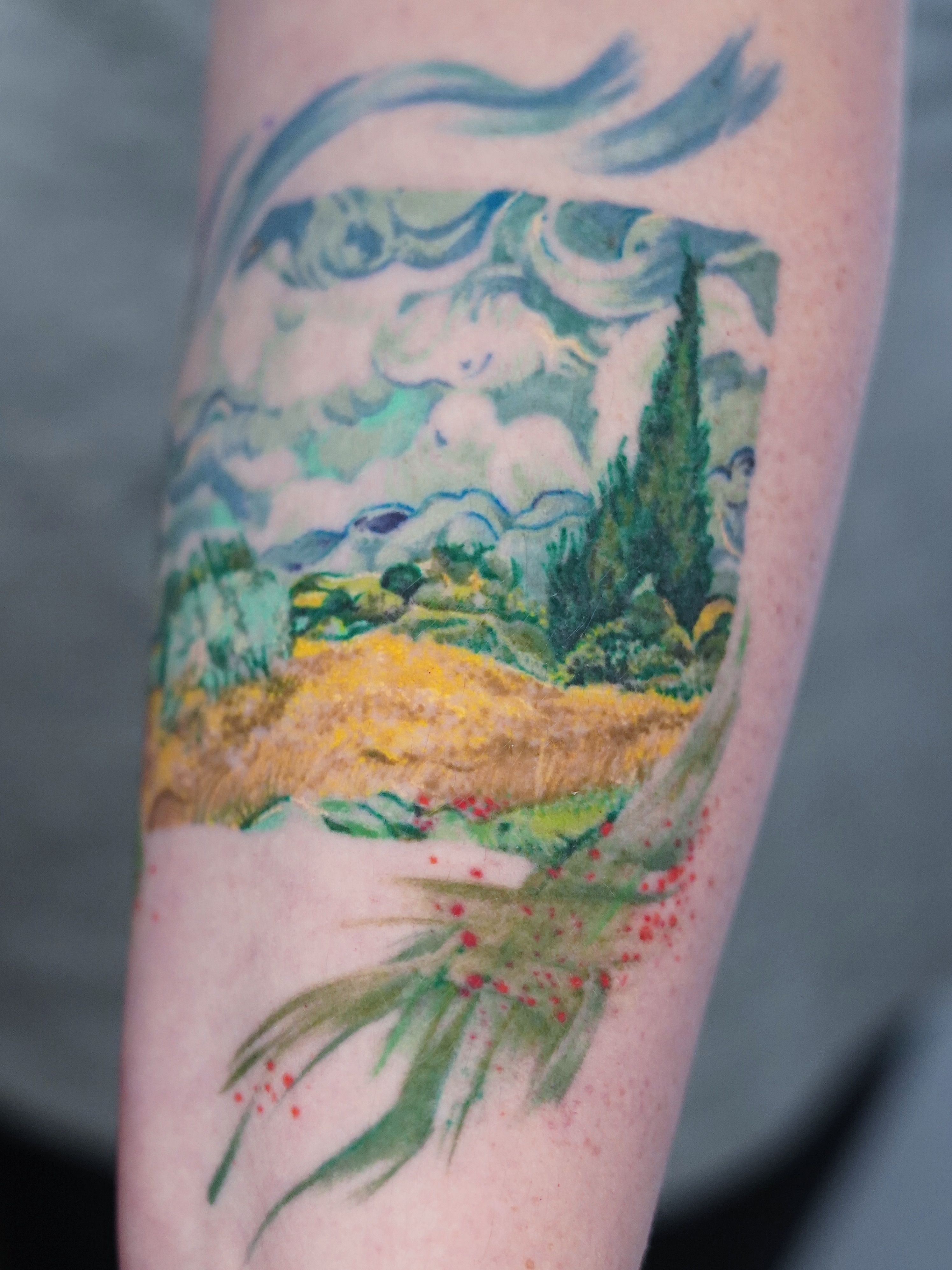 Landscape watercolor tattoo on the forearm by Tate Wortham