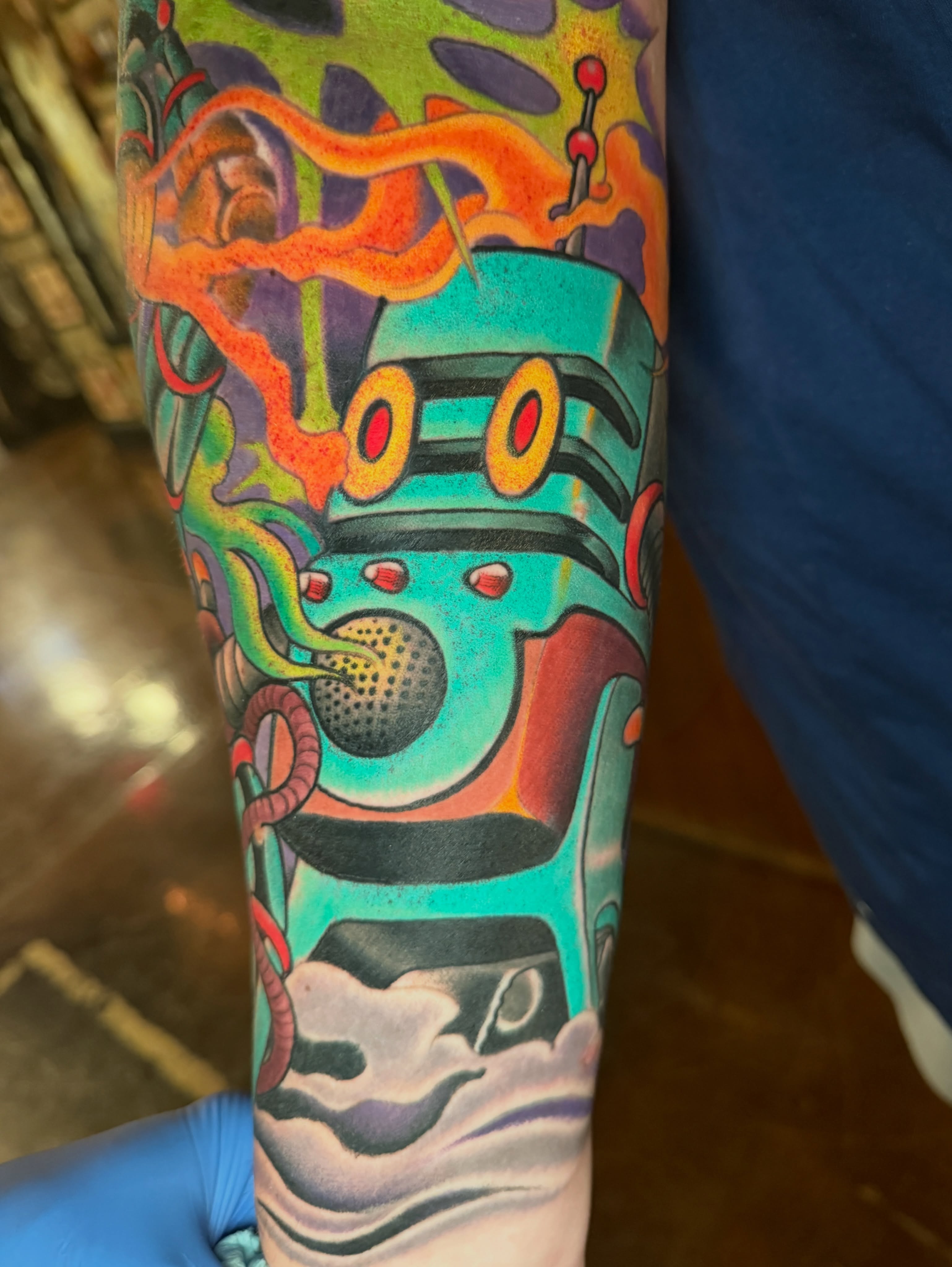 Robotic vehicle new school tattoo on the forearm by JoshUA Bowers, Des Moines, Iowa