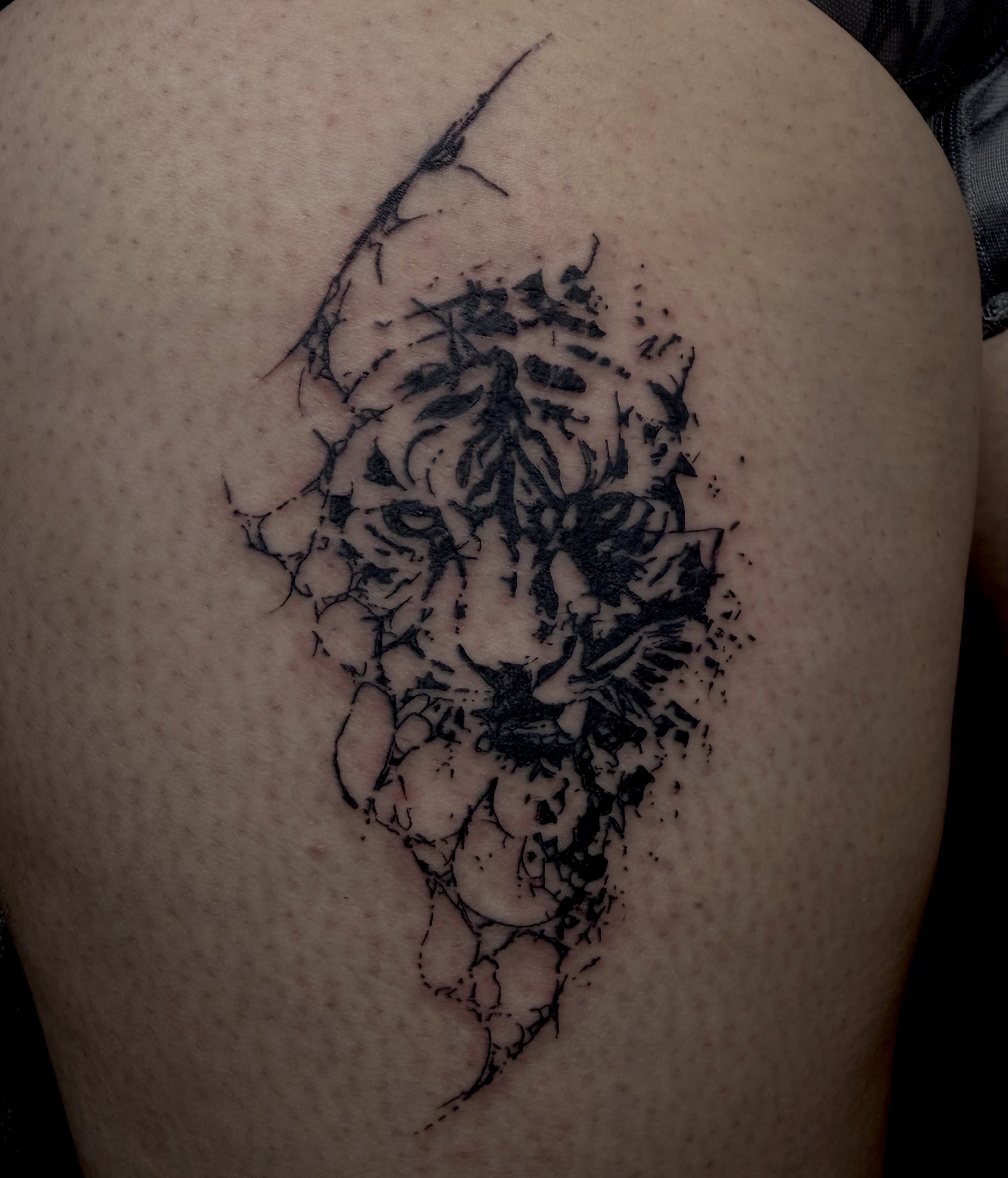 Tiger black and grey tattoo on the shoulder by Jordan Sandoval