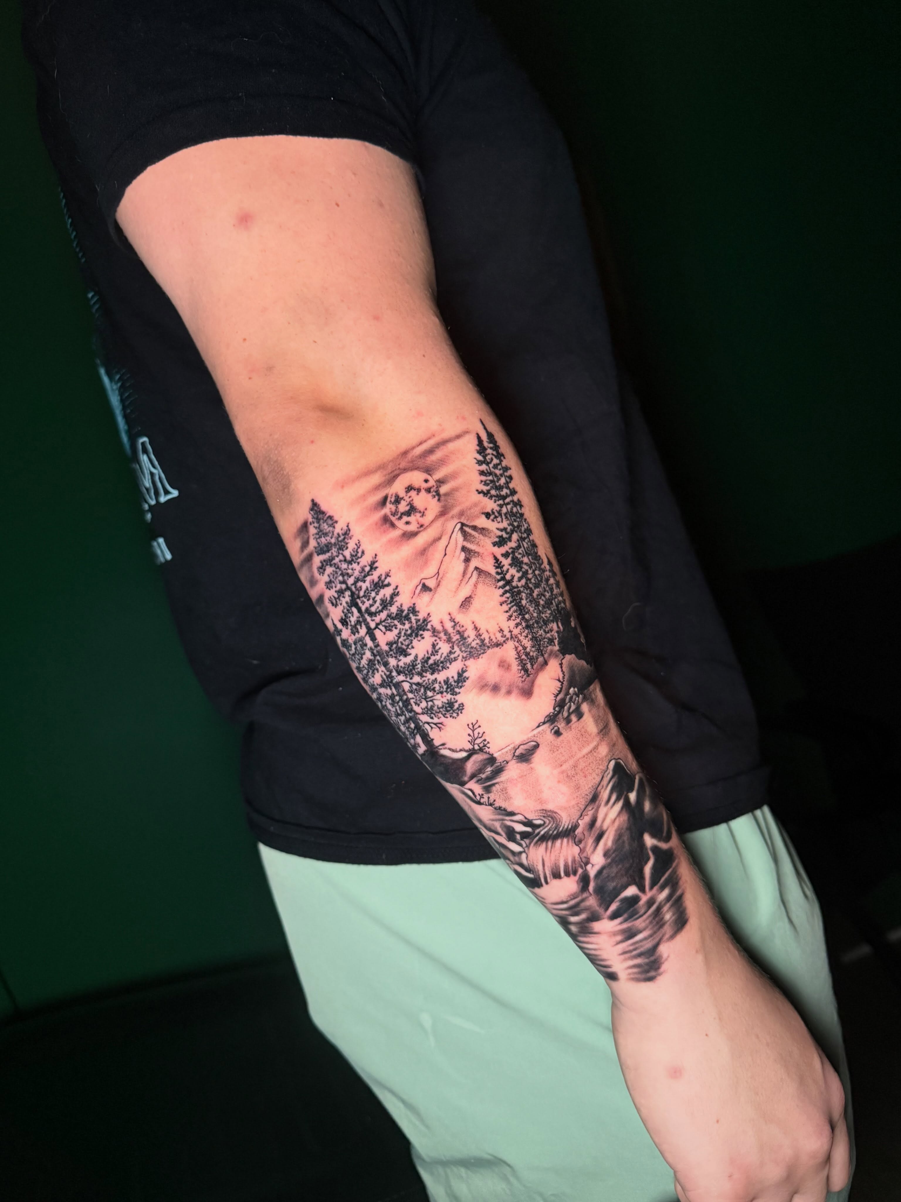 Forest landscape realism tattoo on the forearm by Steve - Tattoo Artist