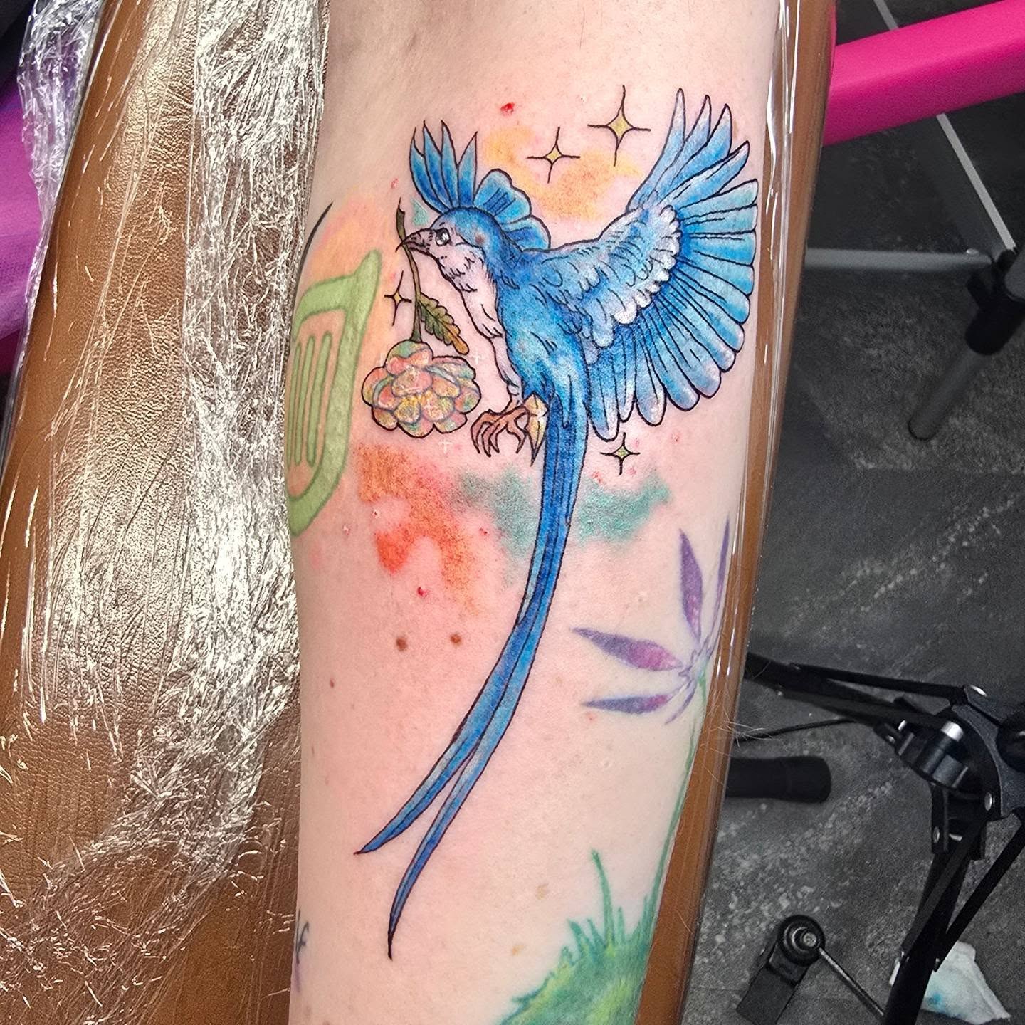Blue bird watercolor tattoo on the forearm by Val Sanchez