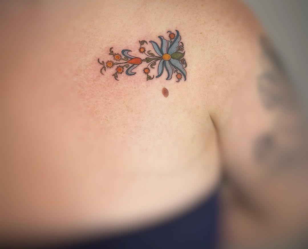 Floral design dotwork tattoo on the shoulder by Holly