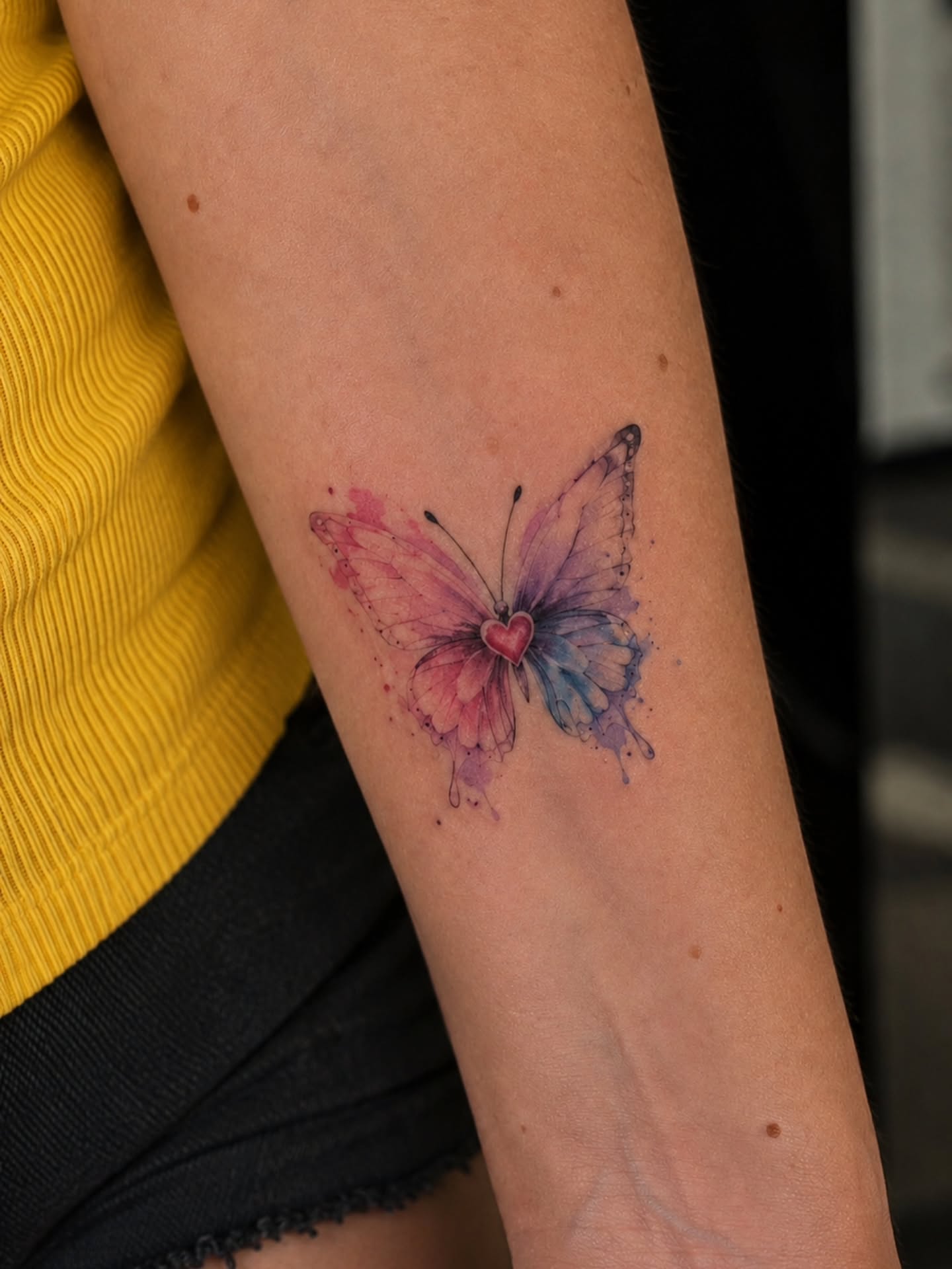Watercolor butterfly watercolor tattoo on the forearm by Dr. Valerio Vegas Tattoo