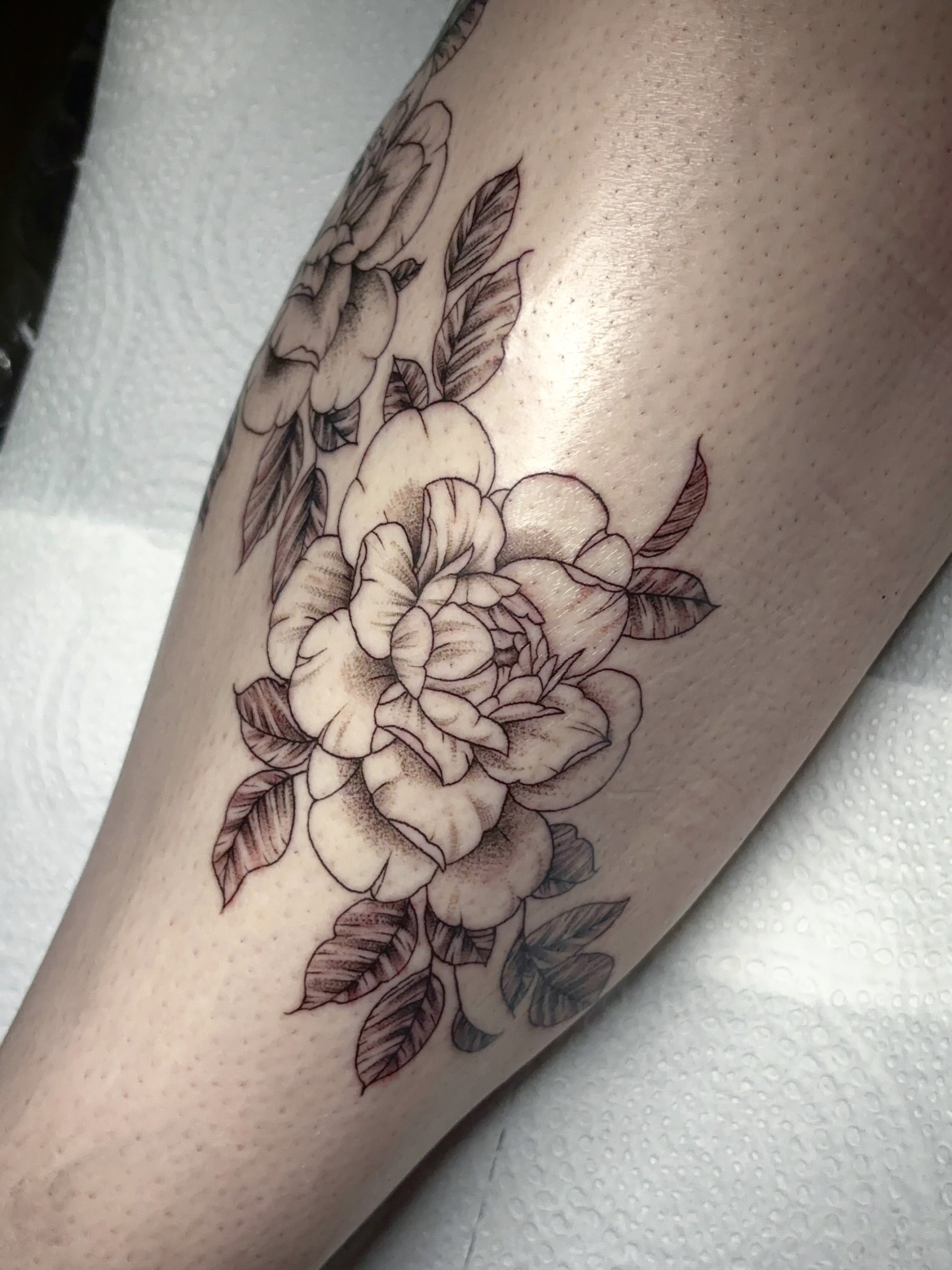Peony flowers black and grey tattoo on the forearm by Grace L