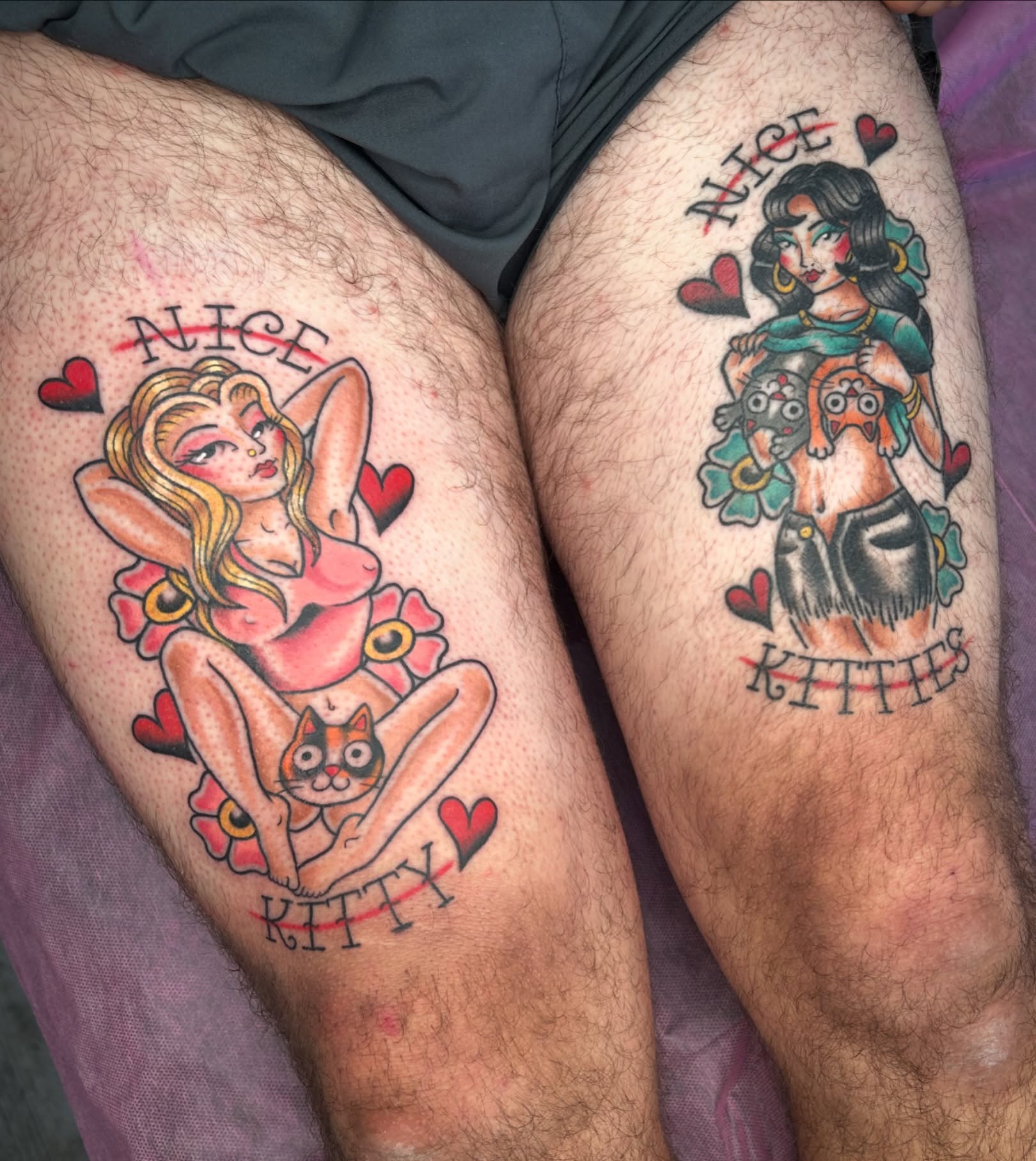 Pin-up girl with cat American traditional tattoo on the thigh by Audrey Migitsch