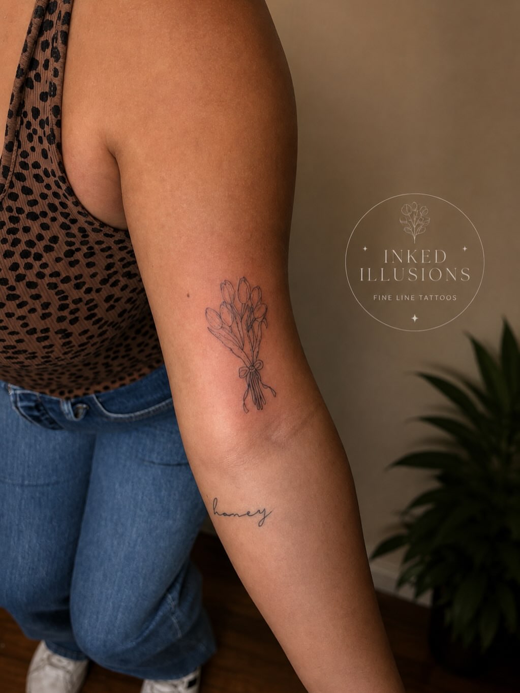 Bouquet of flowers fine line tattoo on the forearm by Victoria Cooper