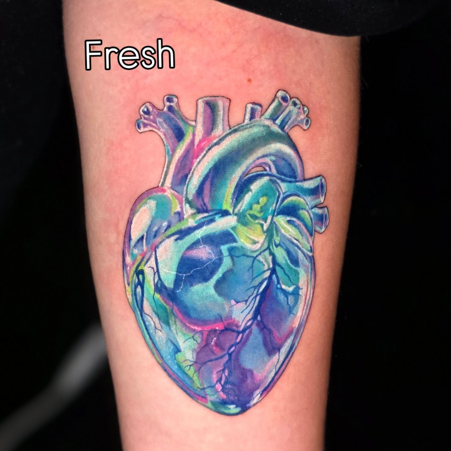 Anatomical heart watercolor tattoo on the forearm by Banana Cake