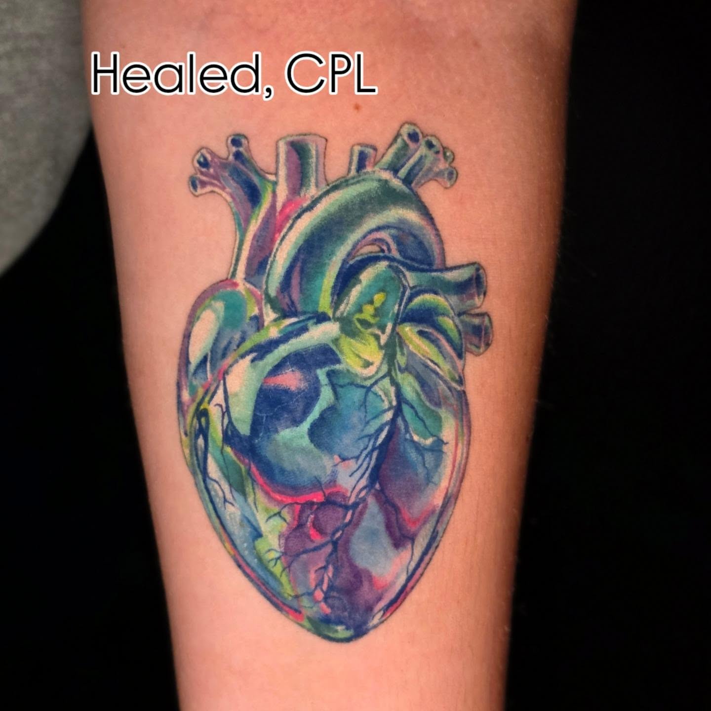 Heart watercolor tattoo on the forearm by Banana Cake