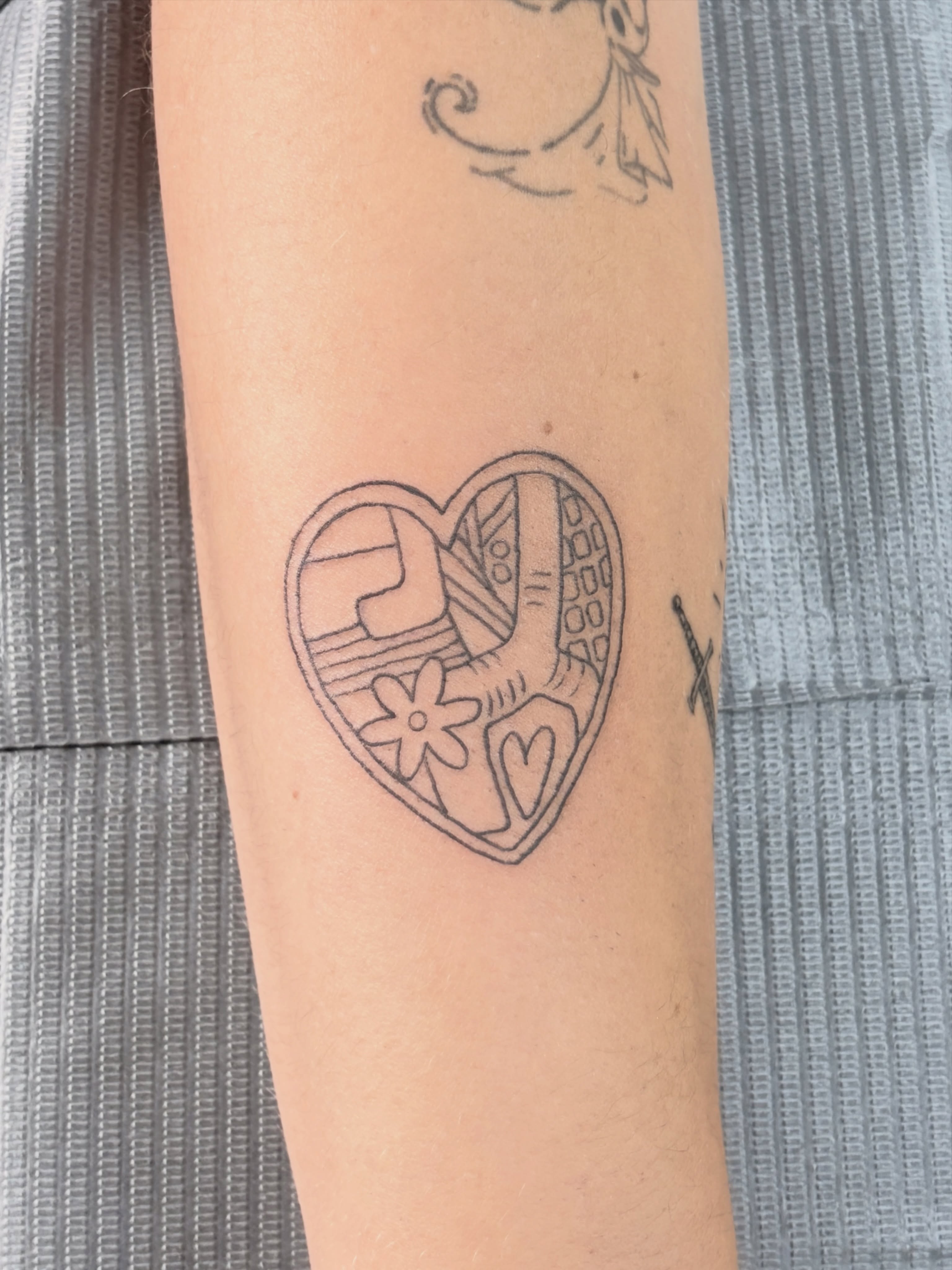 Heart geometric tattoo on the forearm by Chris, Cleveland, Ohio
