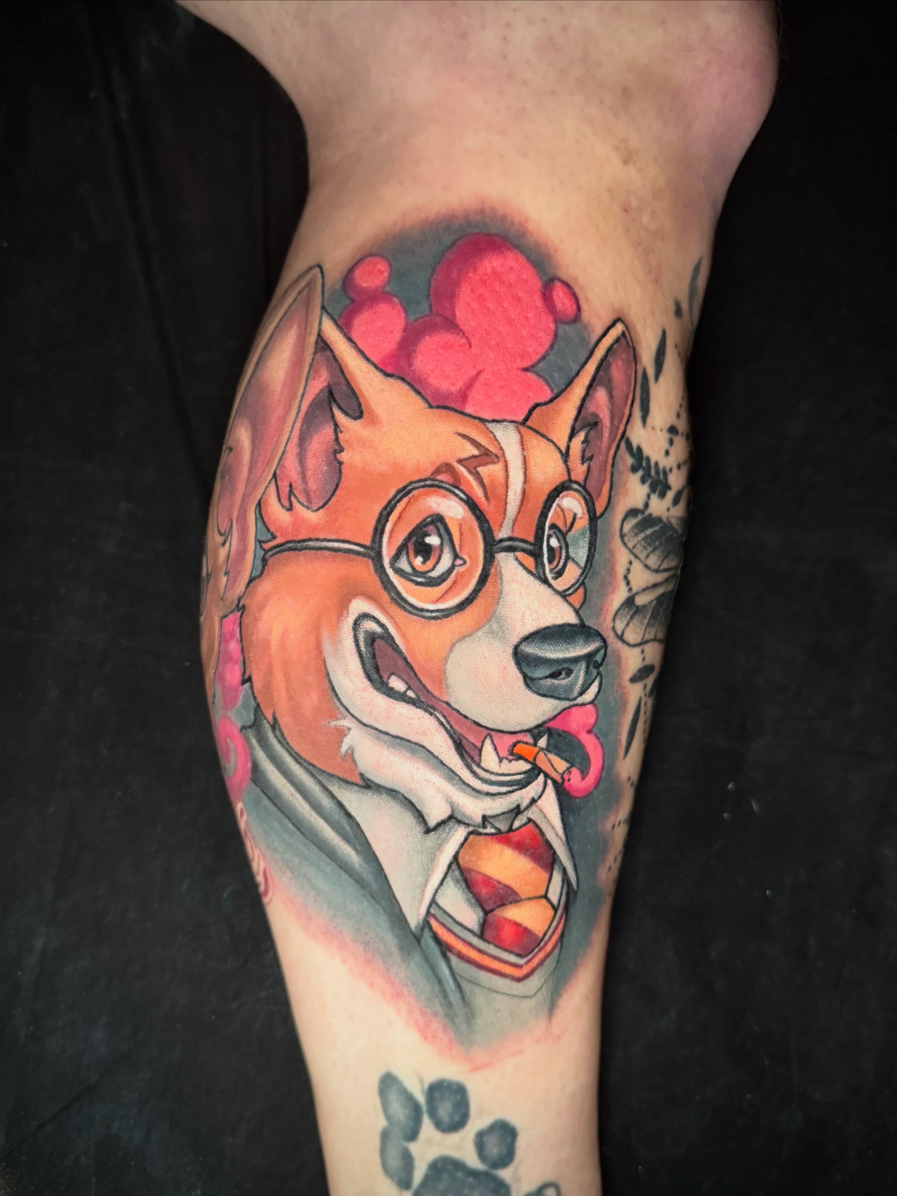 Dog wearing glasses realism tattoo on the forearm by Kevin Boudreau Newschool Tattoos