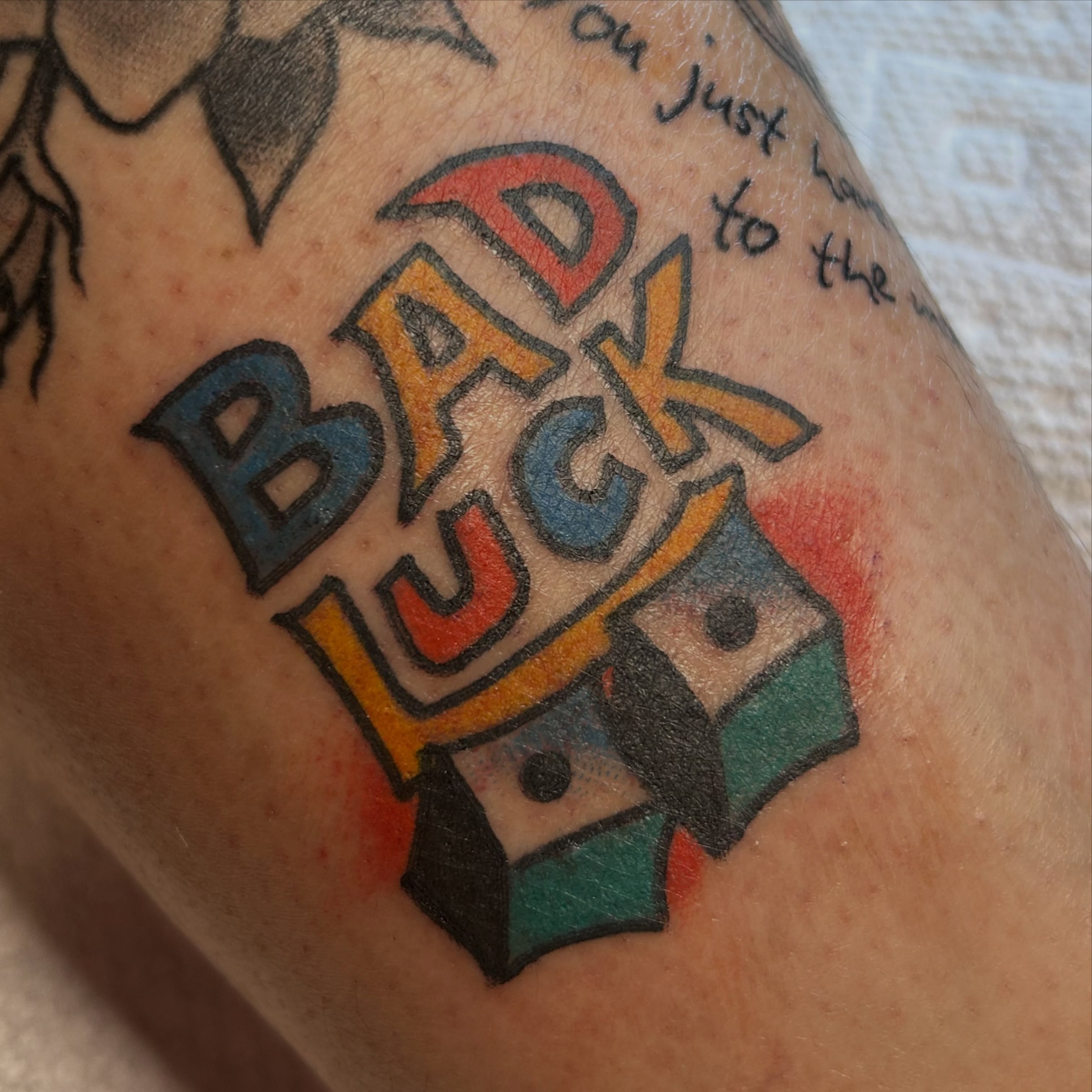 Bad luck new school tattoo on the forearm by Erin Einhorn