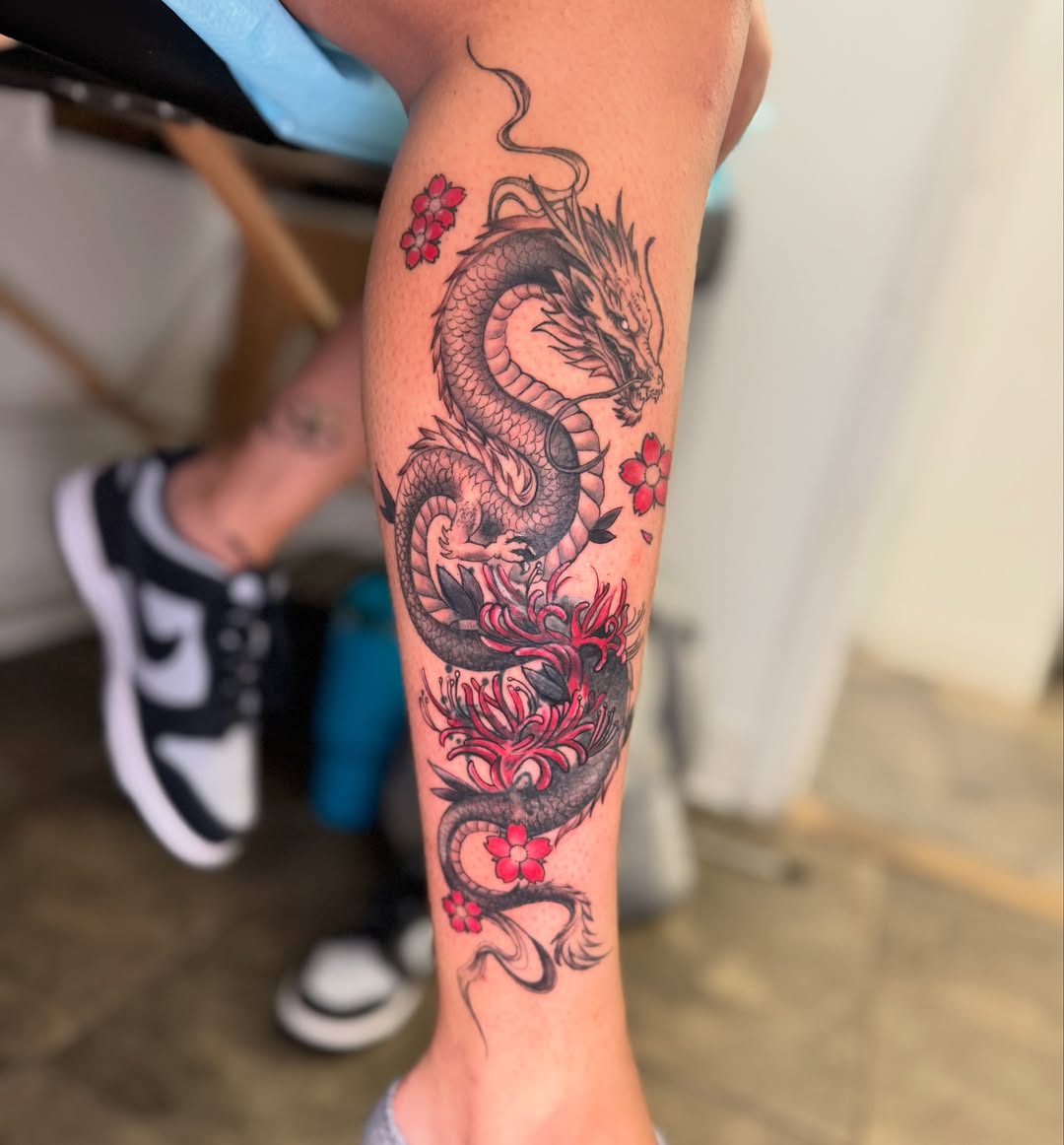 Dragon and cherry blossoms japanese irezumi tattoo on the forearm by Vega