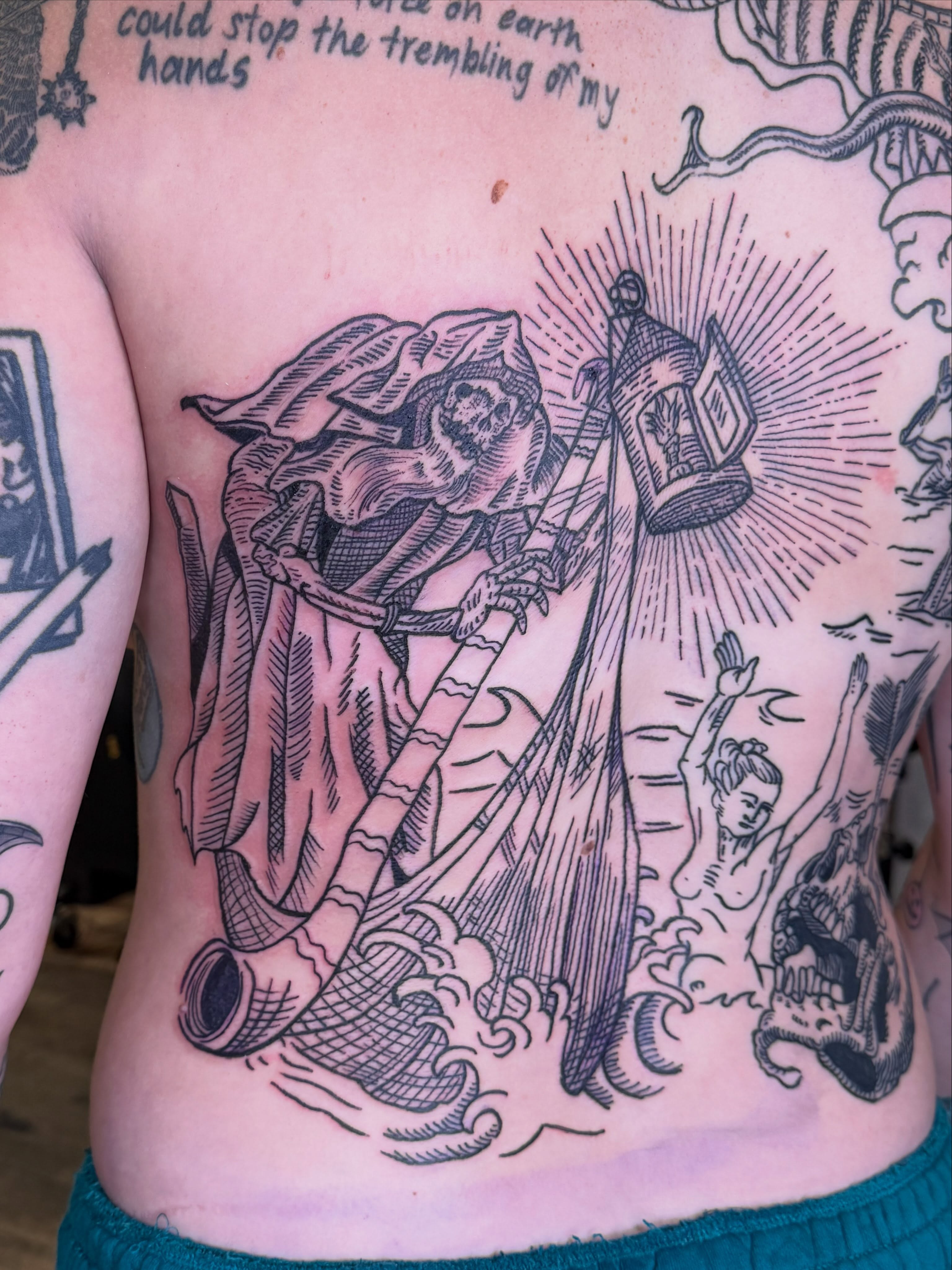 Death figure with lantern American traditional tattoo on the ribs by Eric Guntor, Philadelphia, Pennsylvania