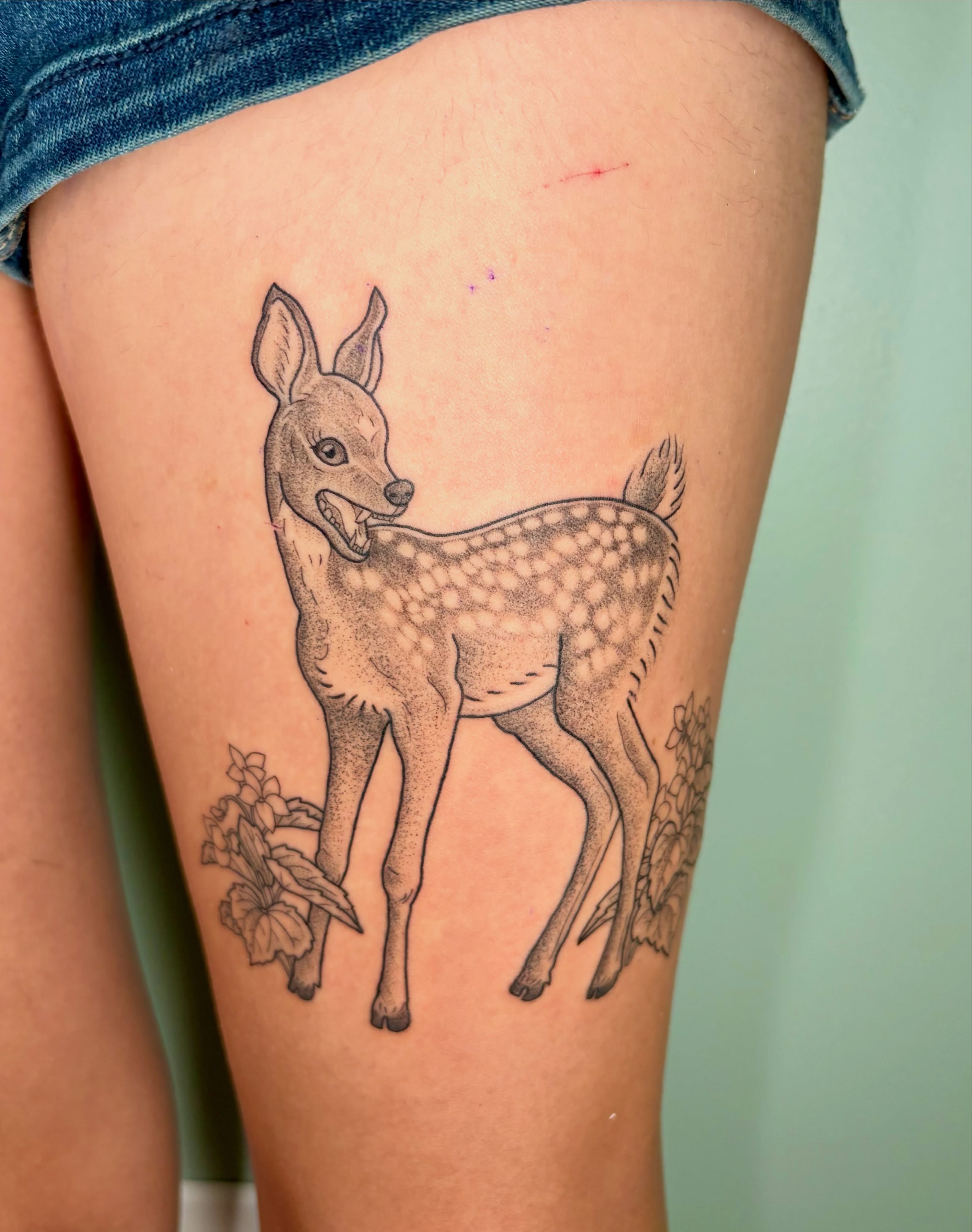 Deer black and grey tattoo on the thigh by Sarah Roach