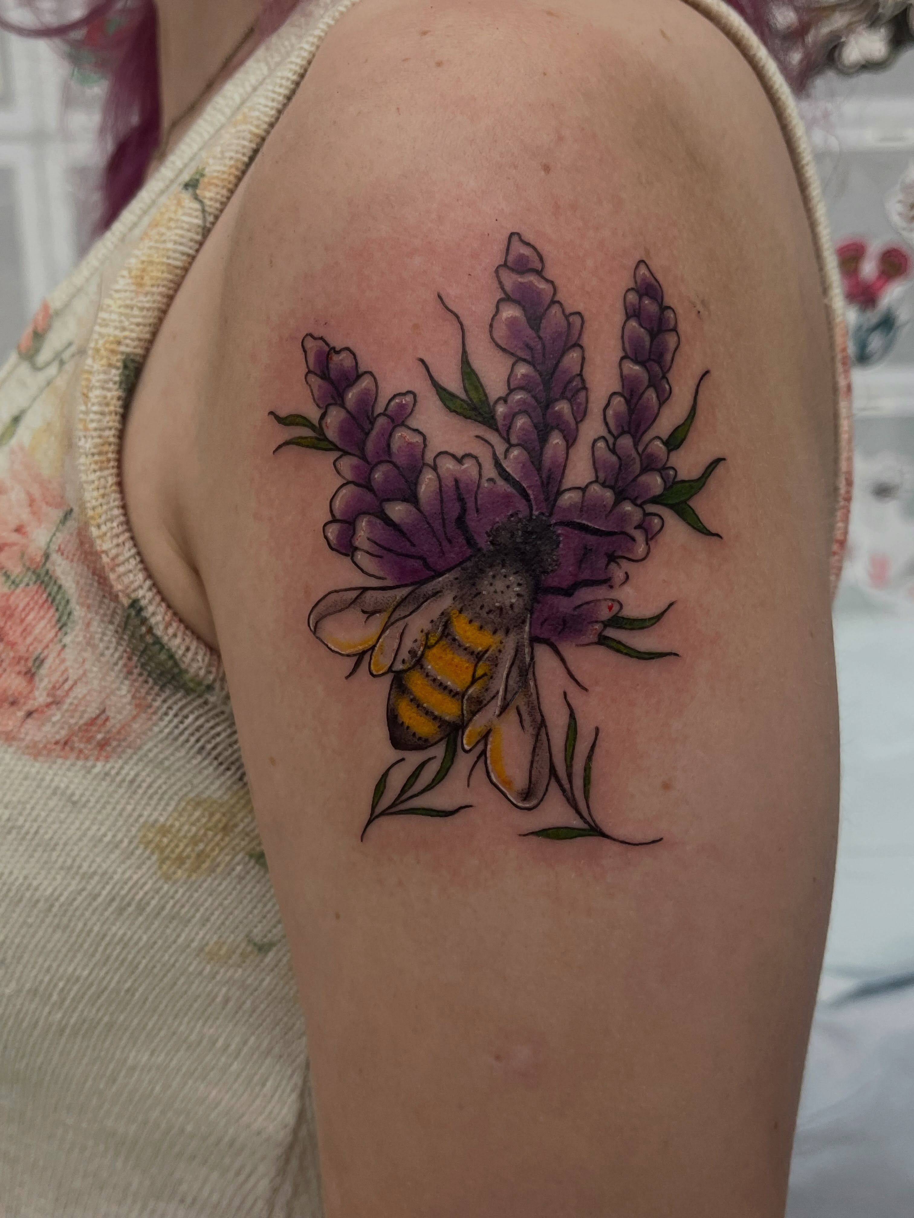 Bee and lavender realism tattoo on the shoulder by Sour Tattoo, Somerville, Massachusetts