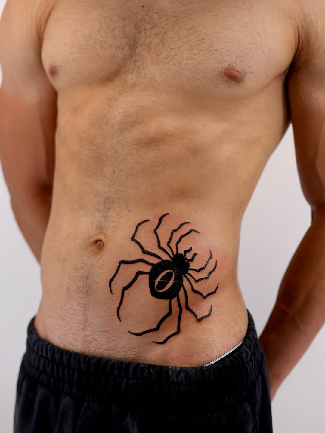 Spider emblem cyber sigilism tattoo on the torso by Sara