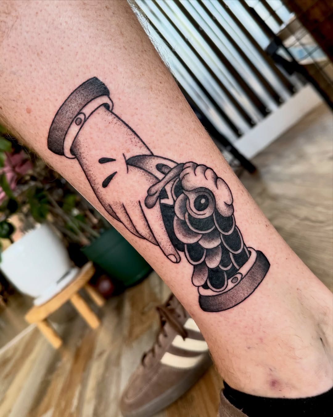 Hourglass black and grey tattoo on the forearm by Eden Allen