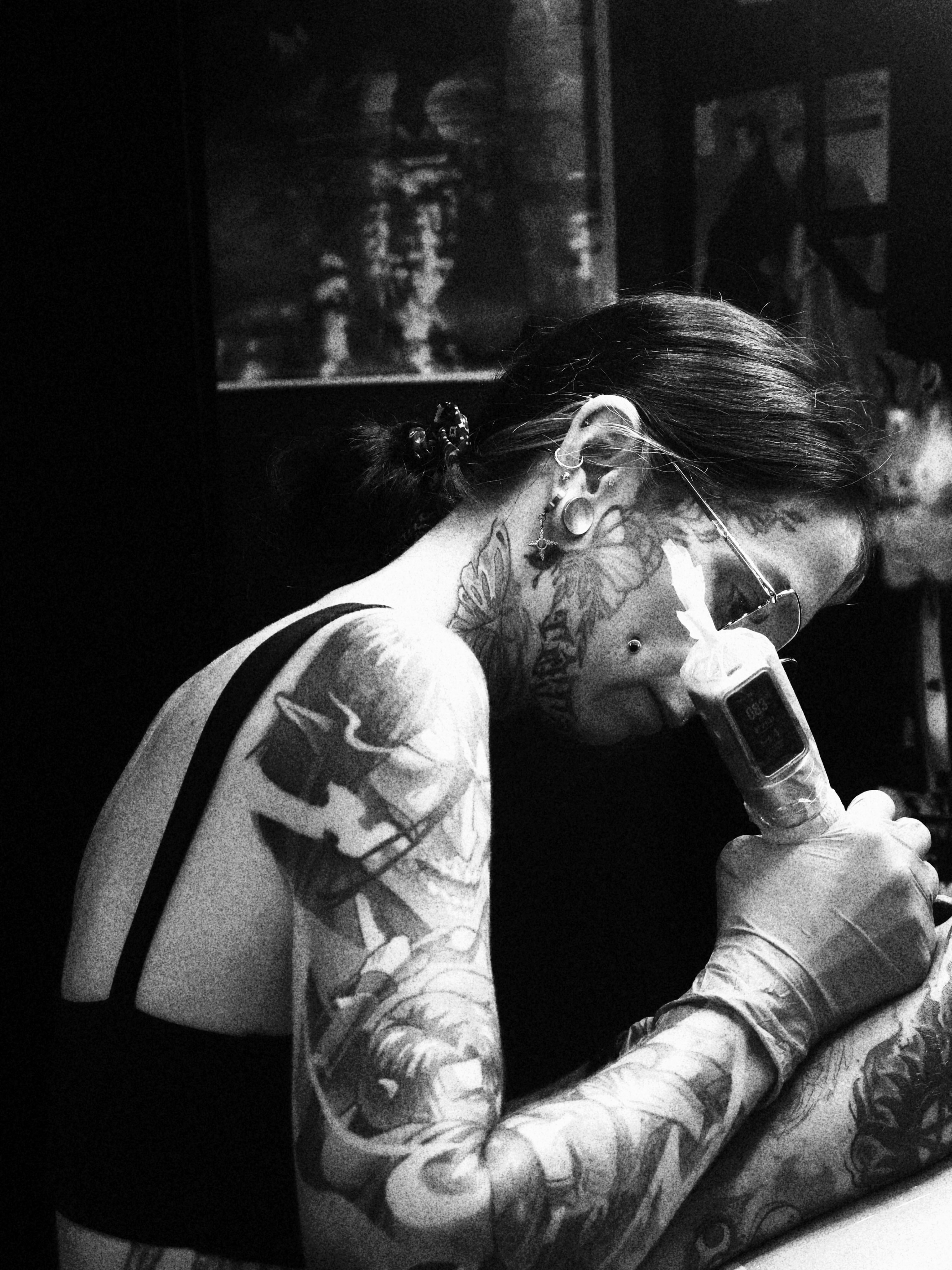 Tattoo artist black and grey tattoo on the upper arm by Emilie Uchiha - Anime Tattoo Artist