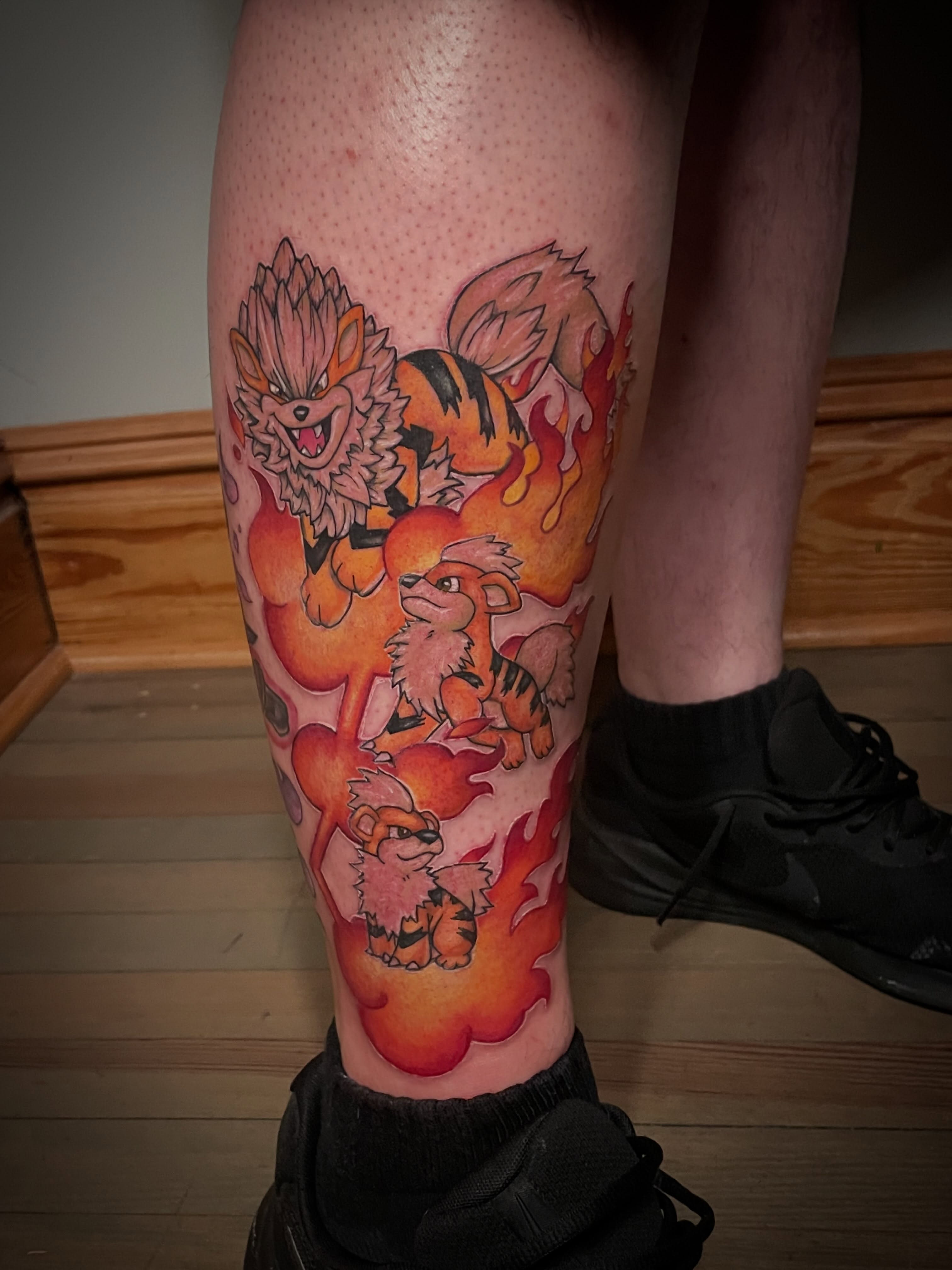 Flame and foxes new school tattoo on the calf by Hannah Copeskey