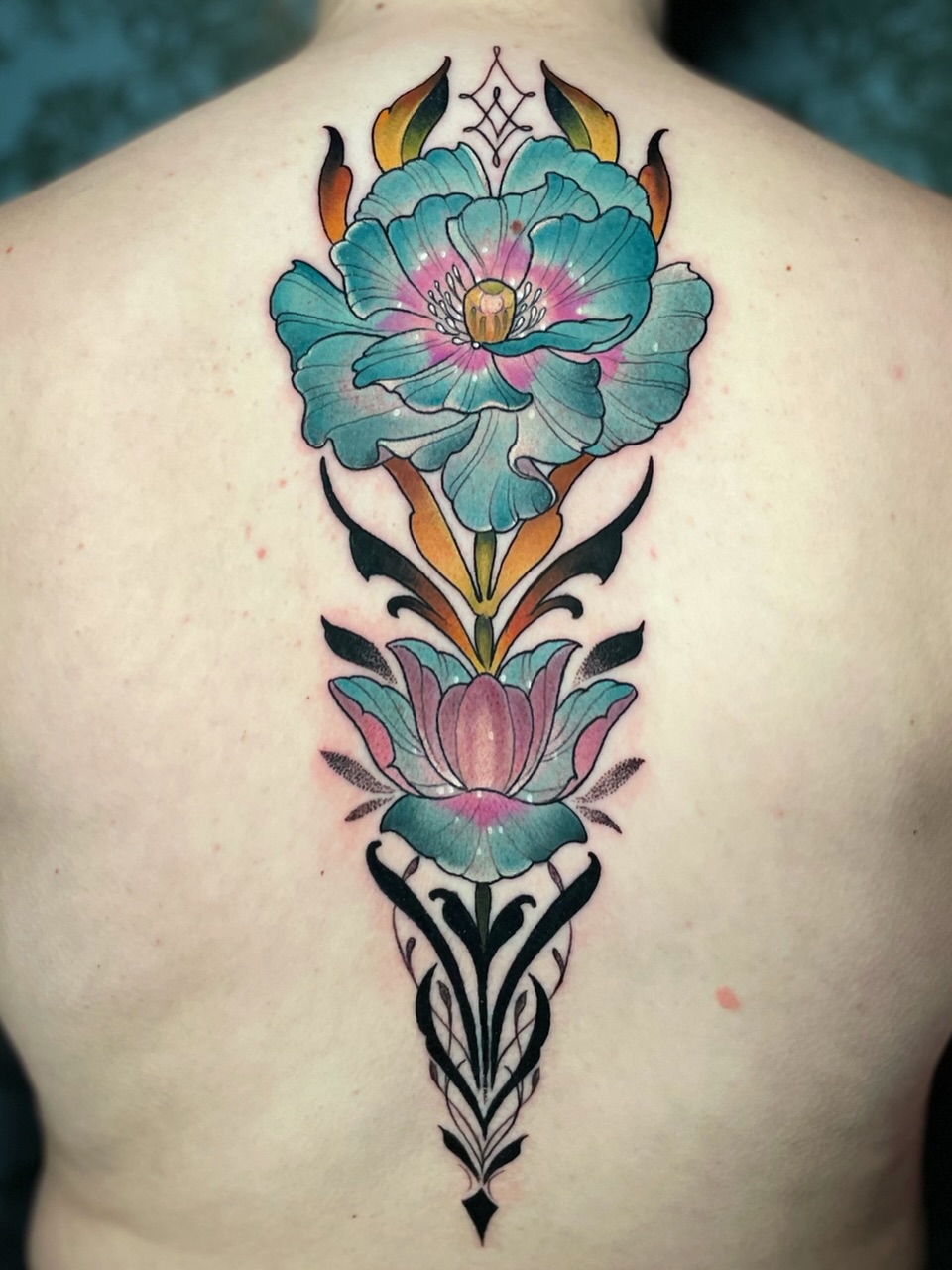 Floral arrangement American traditional tattoo on the back by Melis Fusco