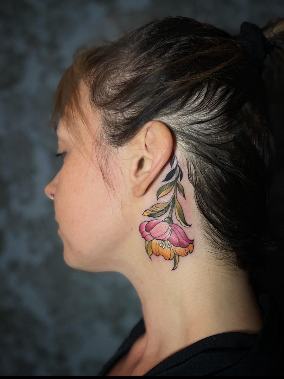 Flower new school tattoo on the neck by Melis Fusco