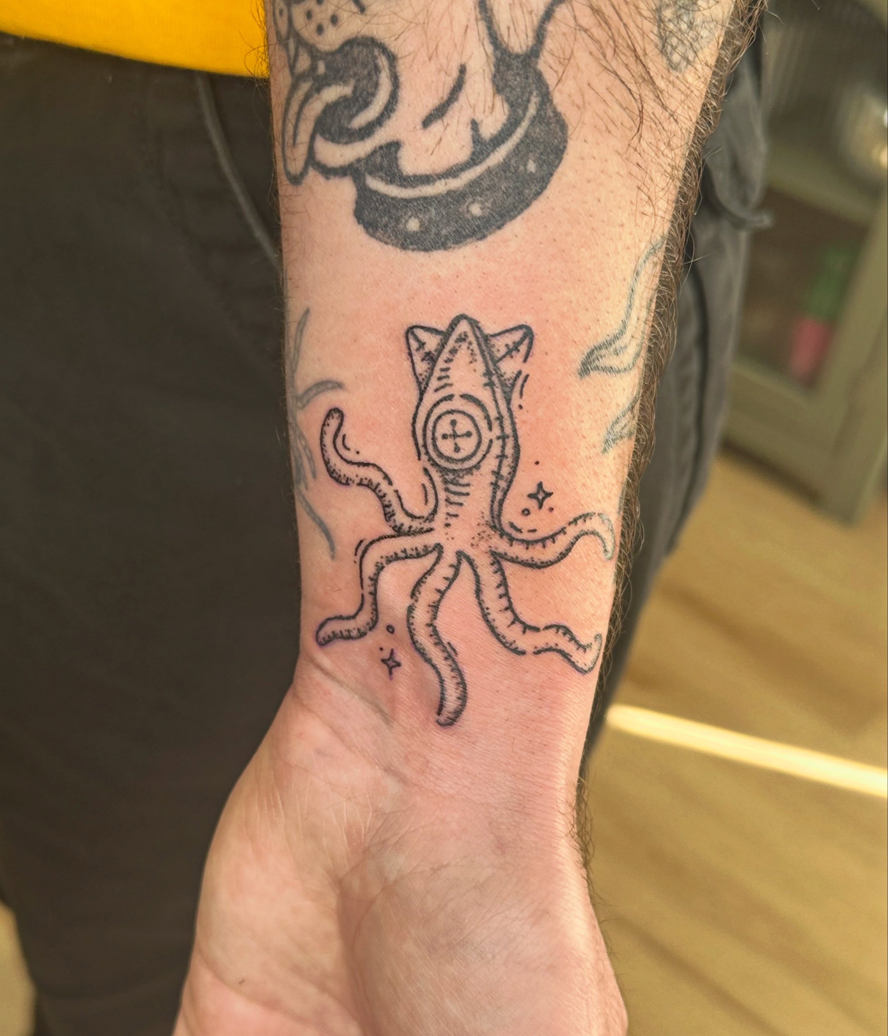 Octopus black and grey tattoo on the forearm by Fleur ๐ฅ