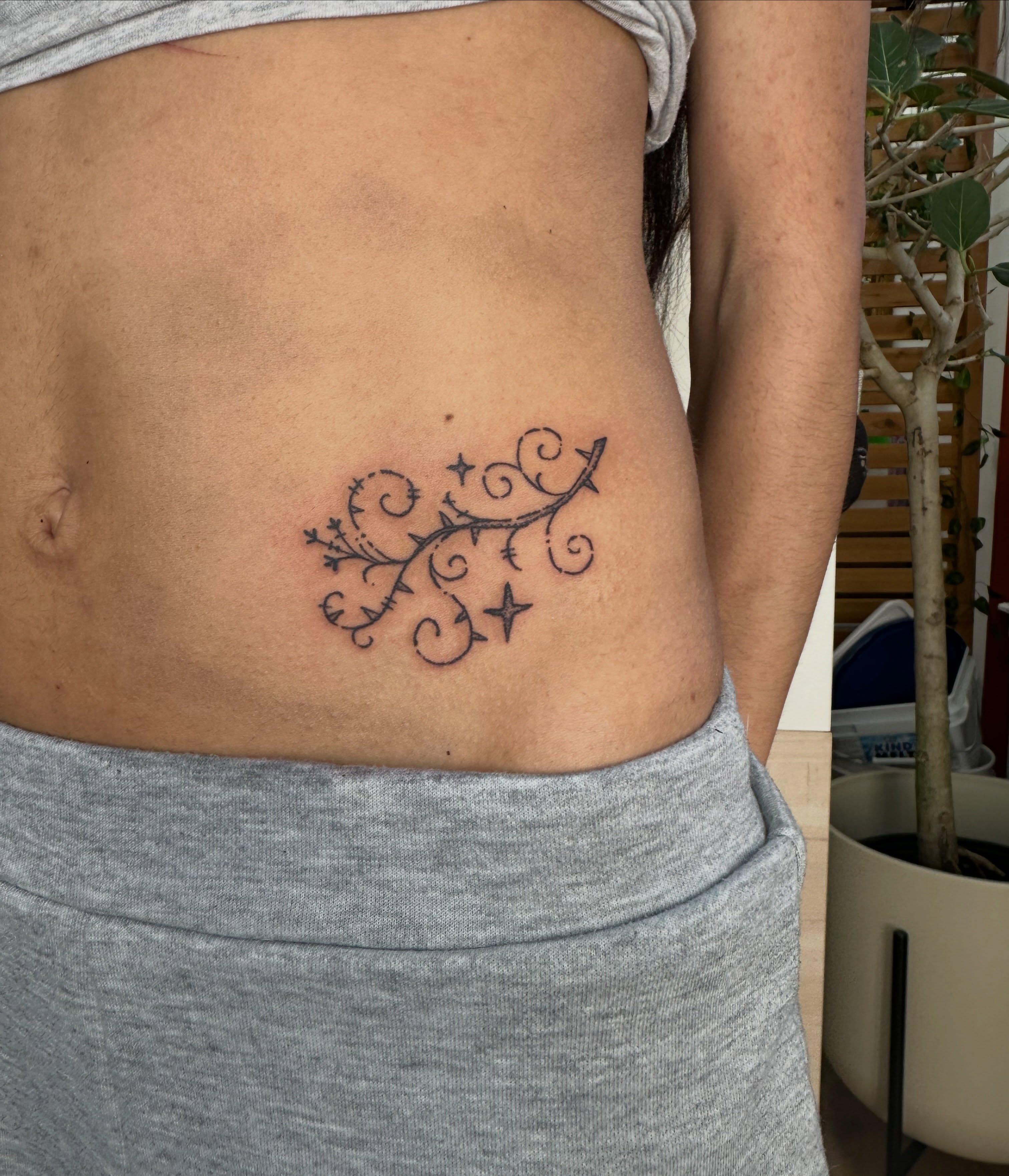 Swirls and stars ornamental tattoo on the ribs by Fleur ๐ฅ