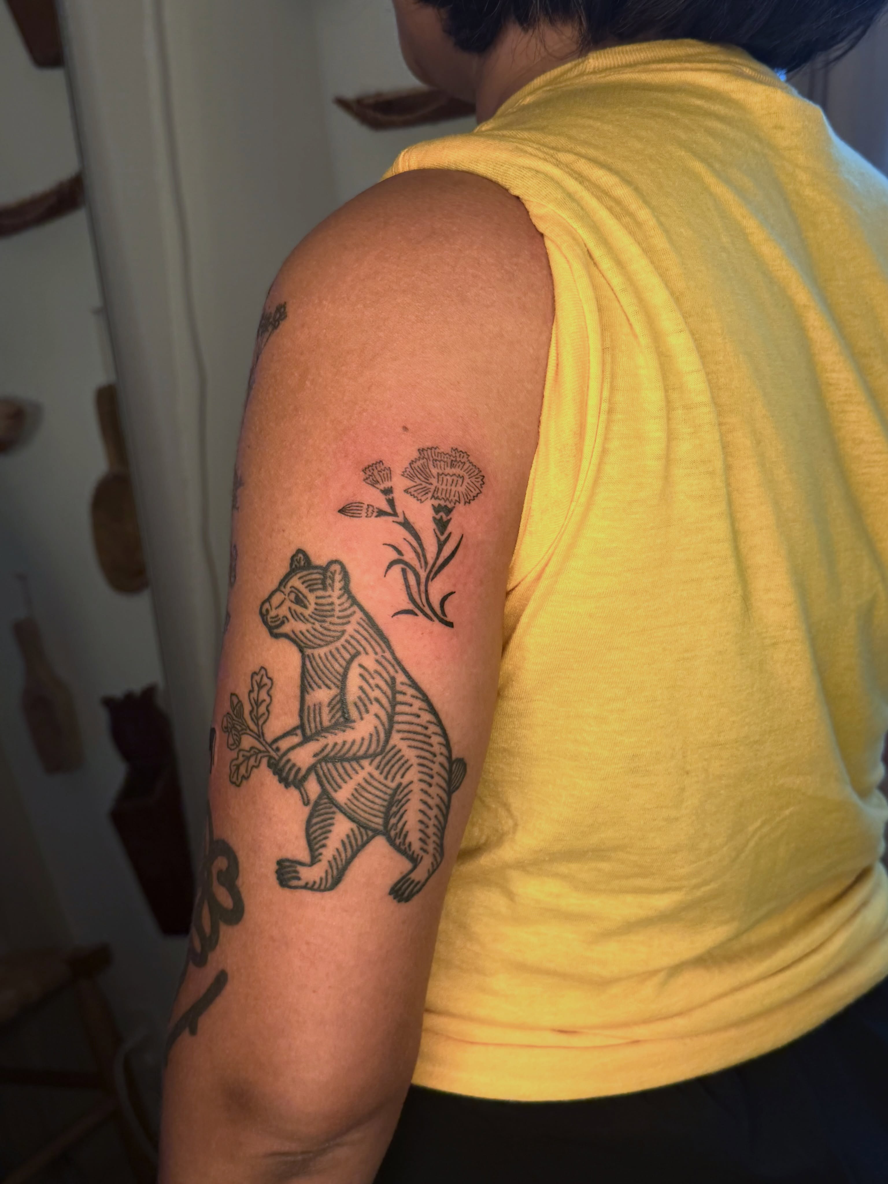 Bear and flowers black and grey tattoo on the upper arm by ♤ Catherine Stengel ♤