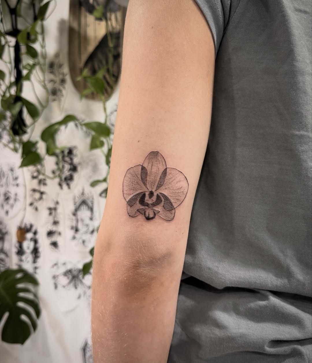 Orchid black and grey tattoo on the forearm by Shannon Misitano