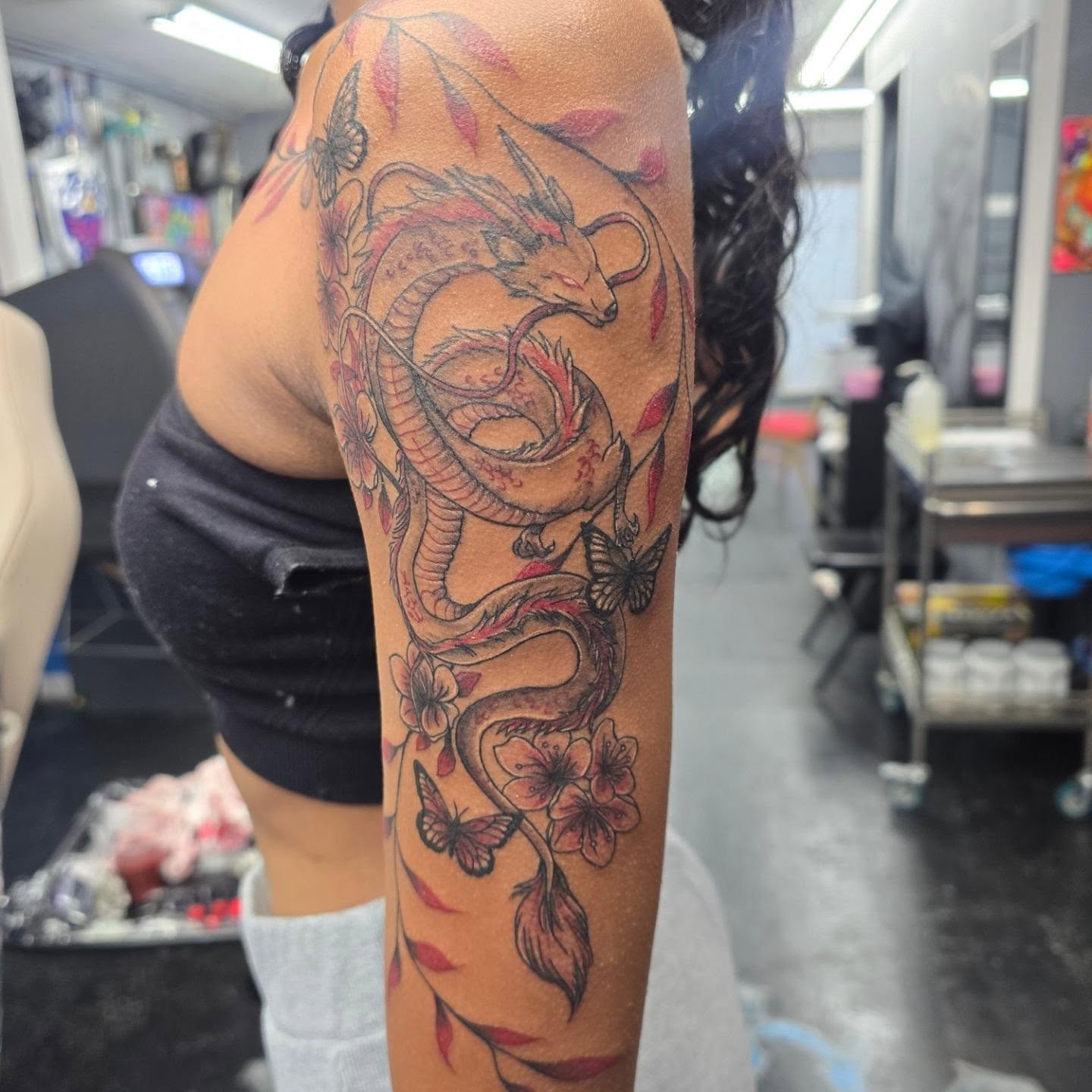 Dragon and cherry blossoms japanese irezumi tattoo on the upper arm by Maddox Kitson🕷