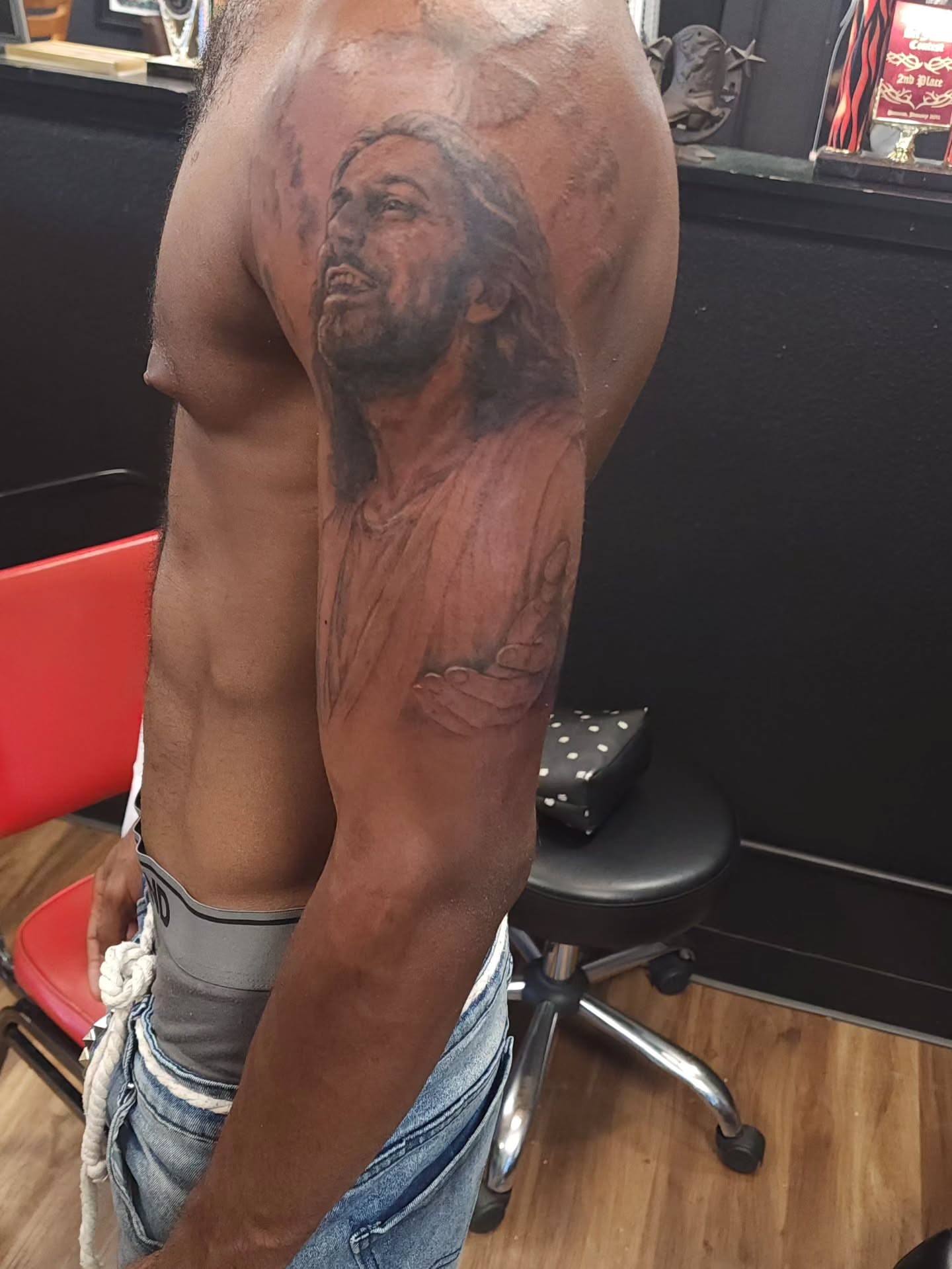 Religious figure realism tattoo on the chest by Dr. Valerio Vegas Tattoo