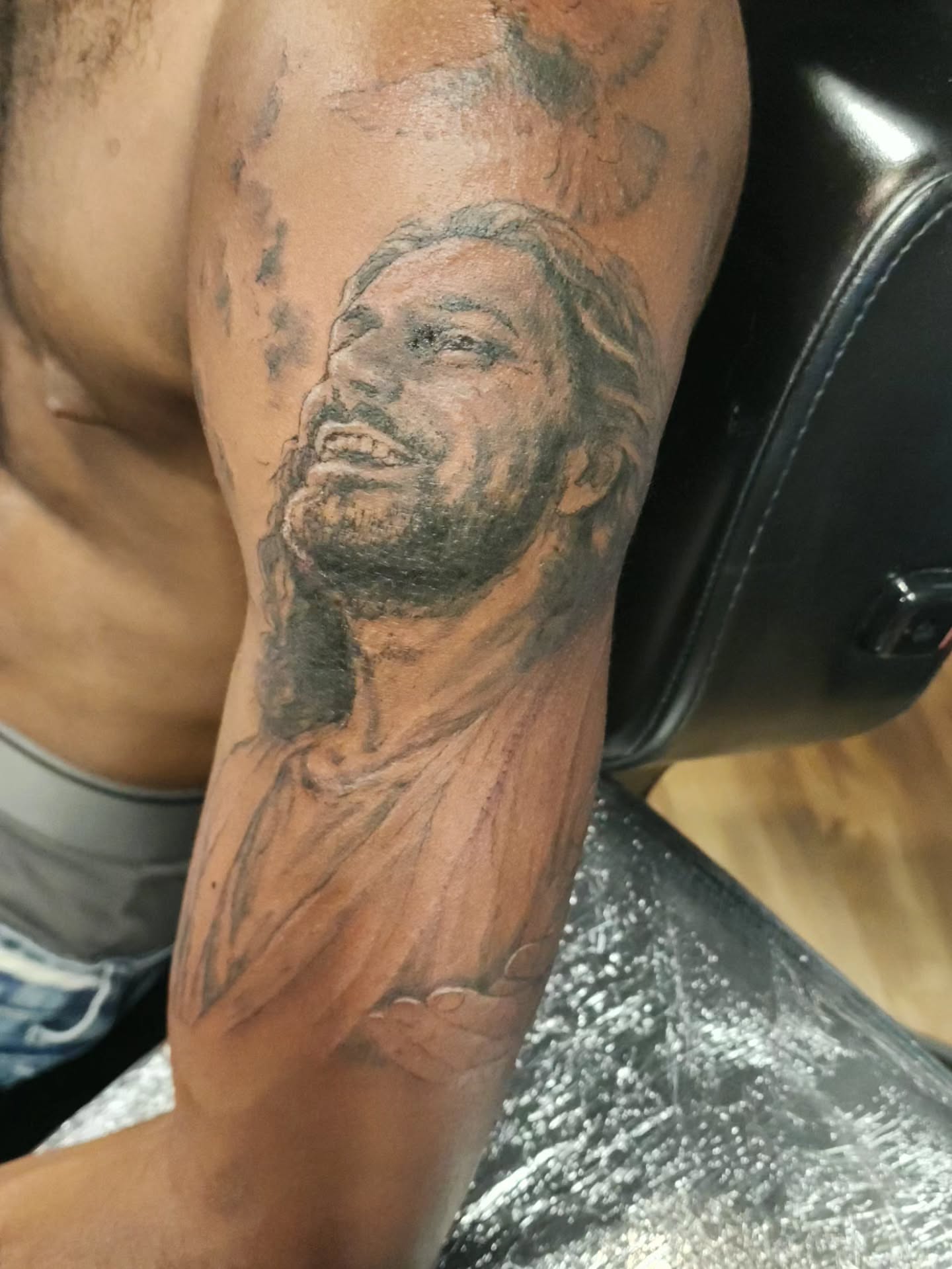 Religious figure realism tattoo on the forearm by Dr. Valerio Vegas Tattoo