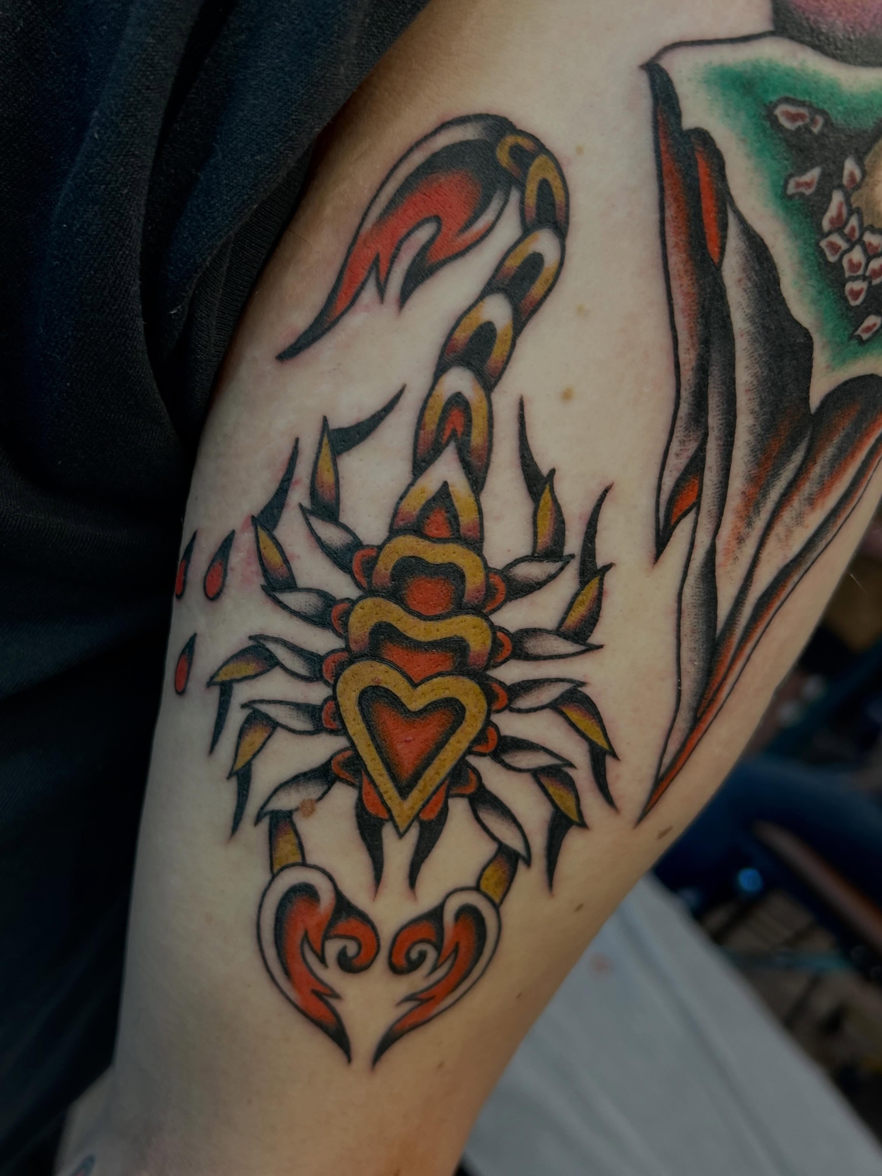 Heart with flames American traditional tattoo on the forearm by Morgan Mansfield