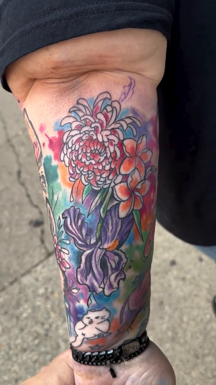 Floral arrangement with irises and chrysanthemums japanese irezumi tattoo by Misty Dawn Brothers, Dayton, Ohio