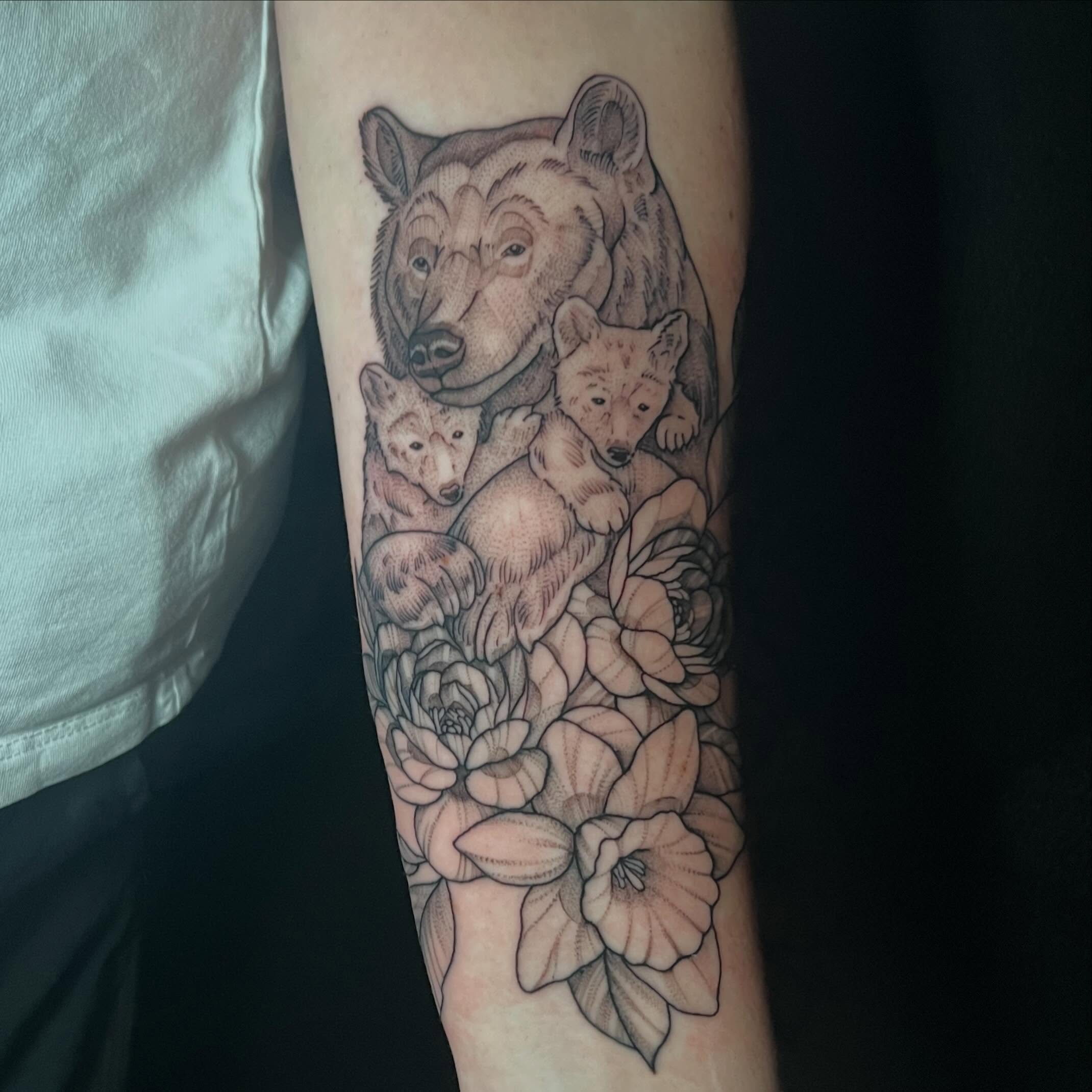 Bear family with flowers realism tattoo on the forearm by Brooke, Kansas City, Missouri