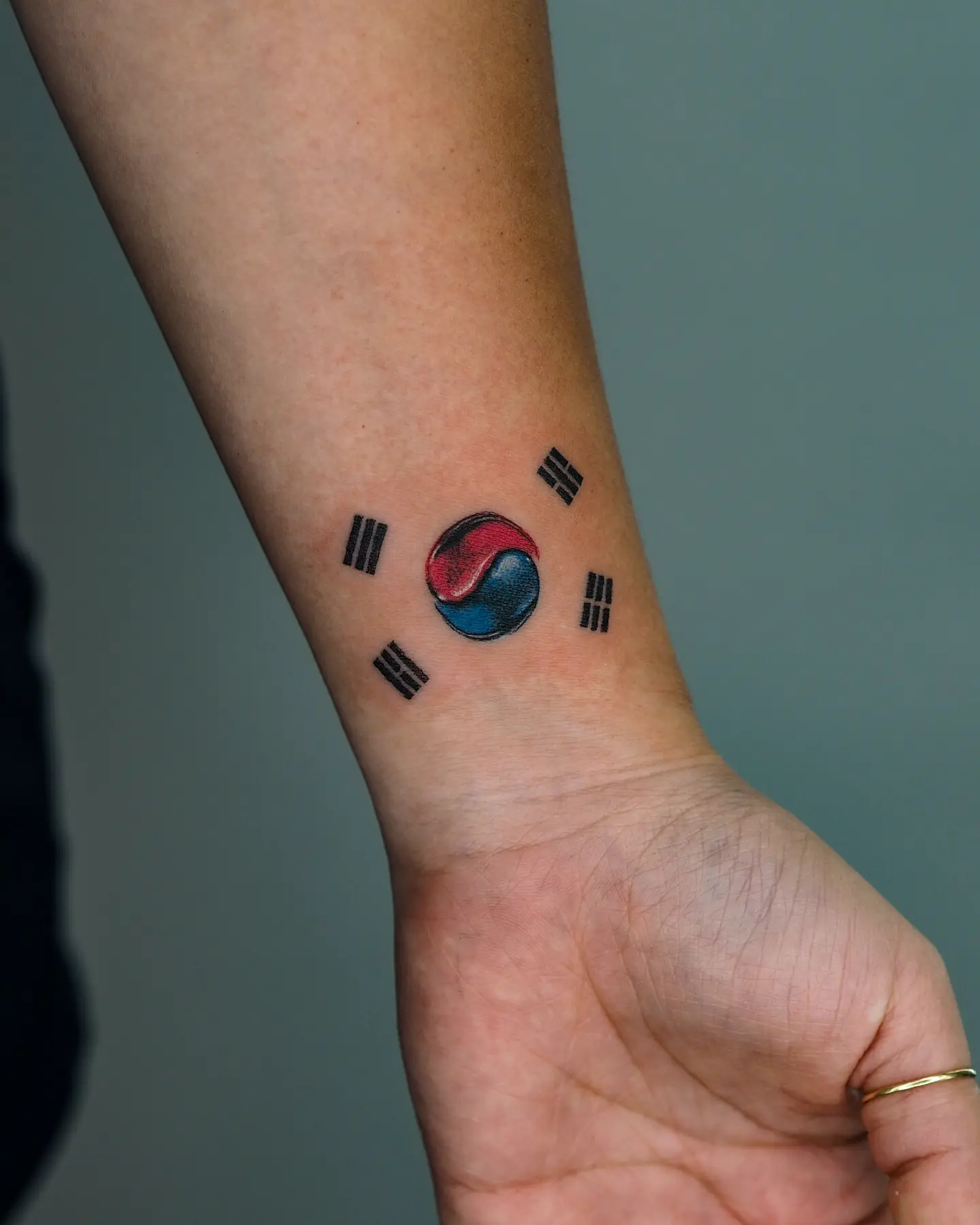 South Korean flag dotwork tattoo on the forearm by MK