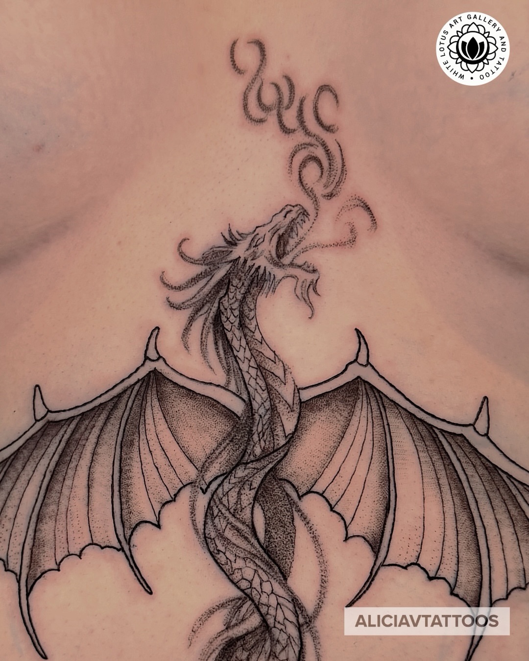 Dragon dotwork tattoo on the chest by Alicia Vasquez