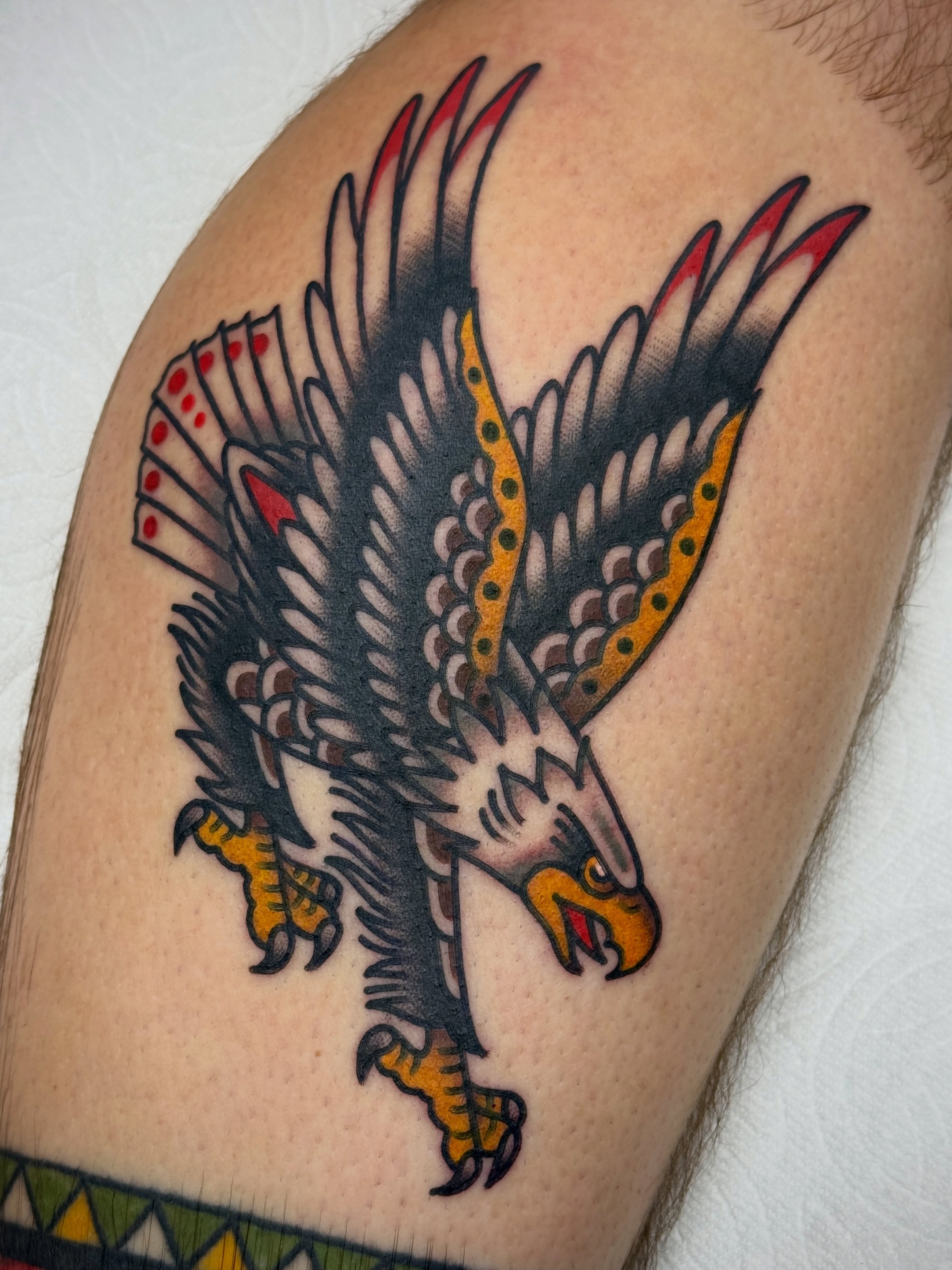 Eagle American traditional tattoo on the shoulder by Jordan Allen