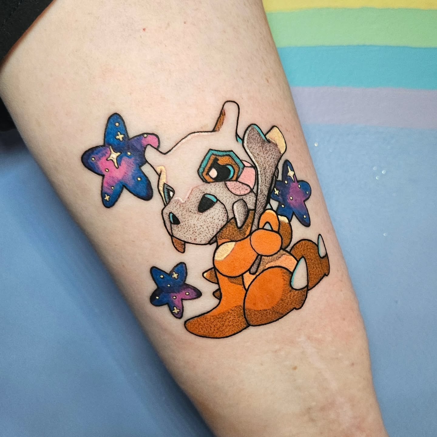 Dinosaur dotwork tattoo on the forearm by Gray