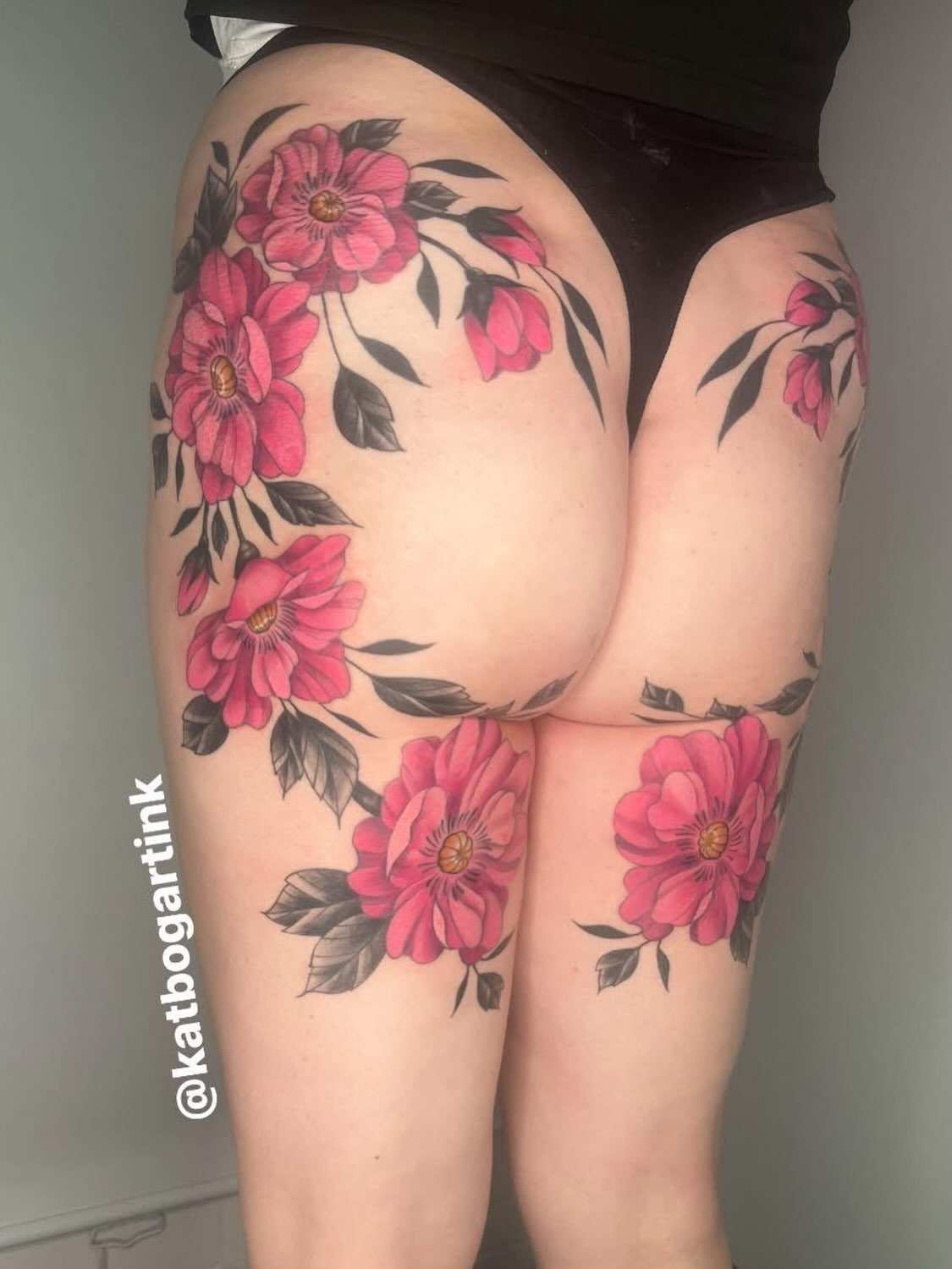 Floral bouquet black and grey tattoo on the thigh by Kat (Scout) Bogart