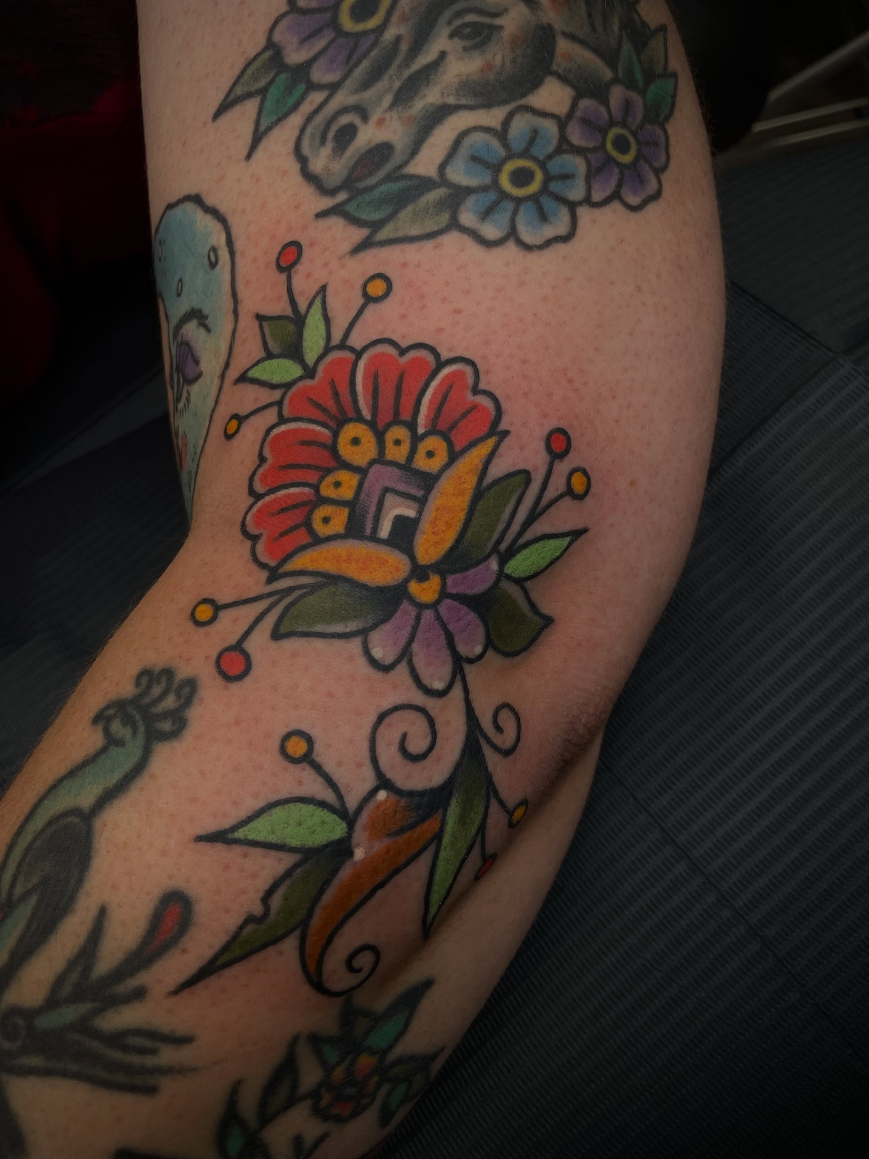 Floral bouquet American traditional tattoo on the forearm by Dave Kruseman
