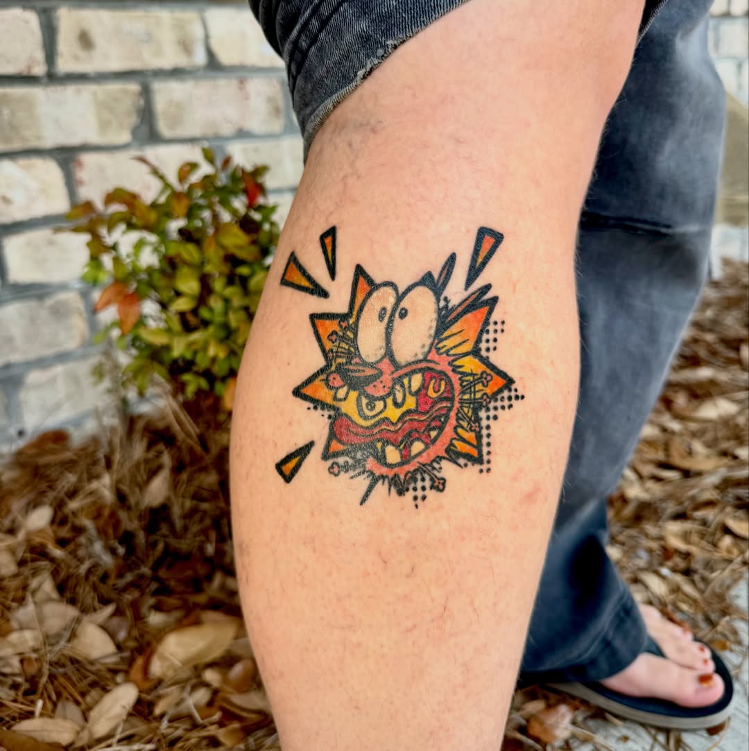 Angry cartoon face American traditional tattoo on the thigh by Brooke Sombati