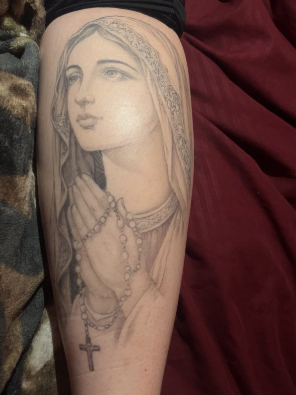 Religious figure realism tattoo on the forearm by Hot Dawg