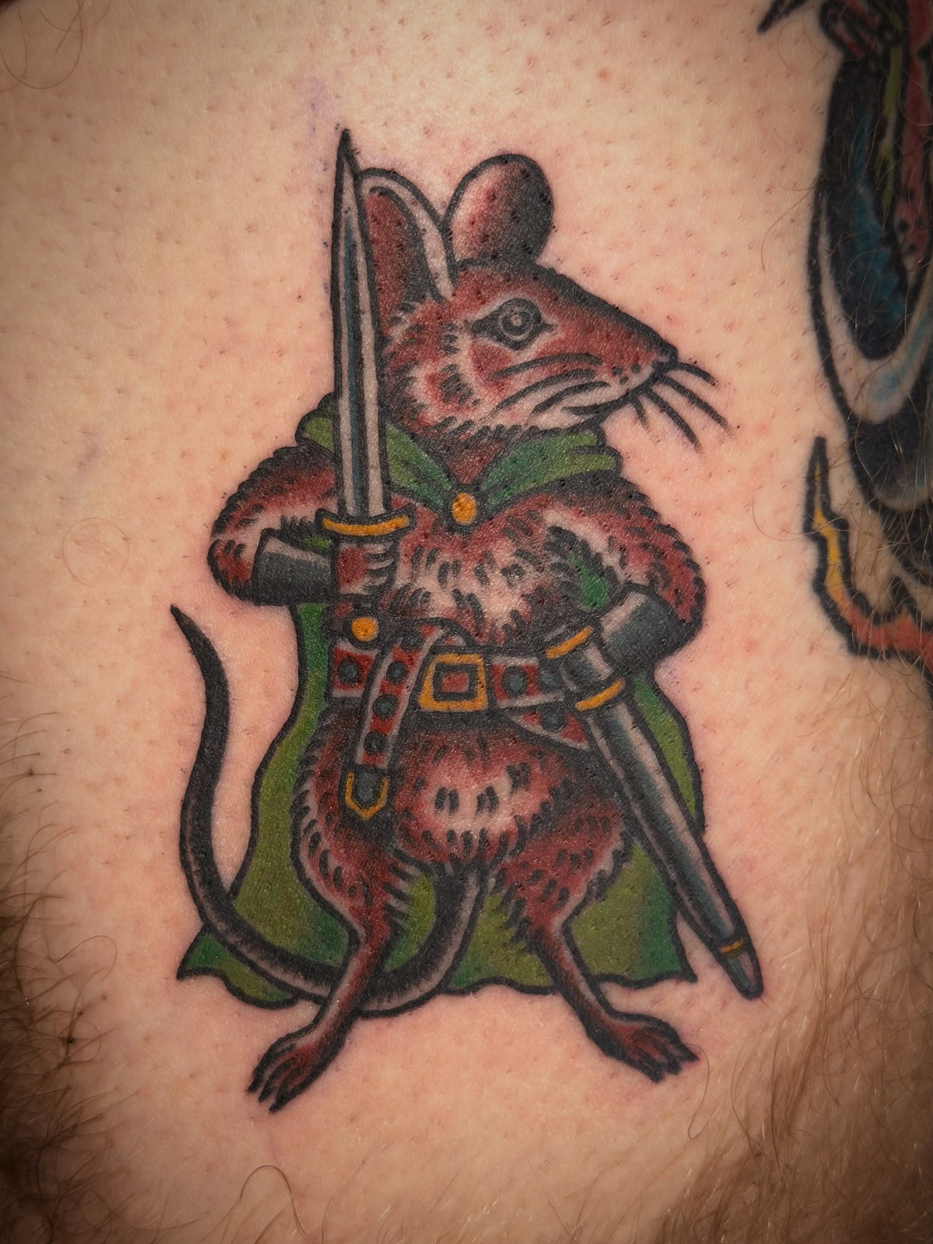Raccoon warrior American traditional tattoo on the thigh by Jesse Swanson, Santa Rosa, California