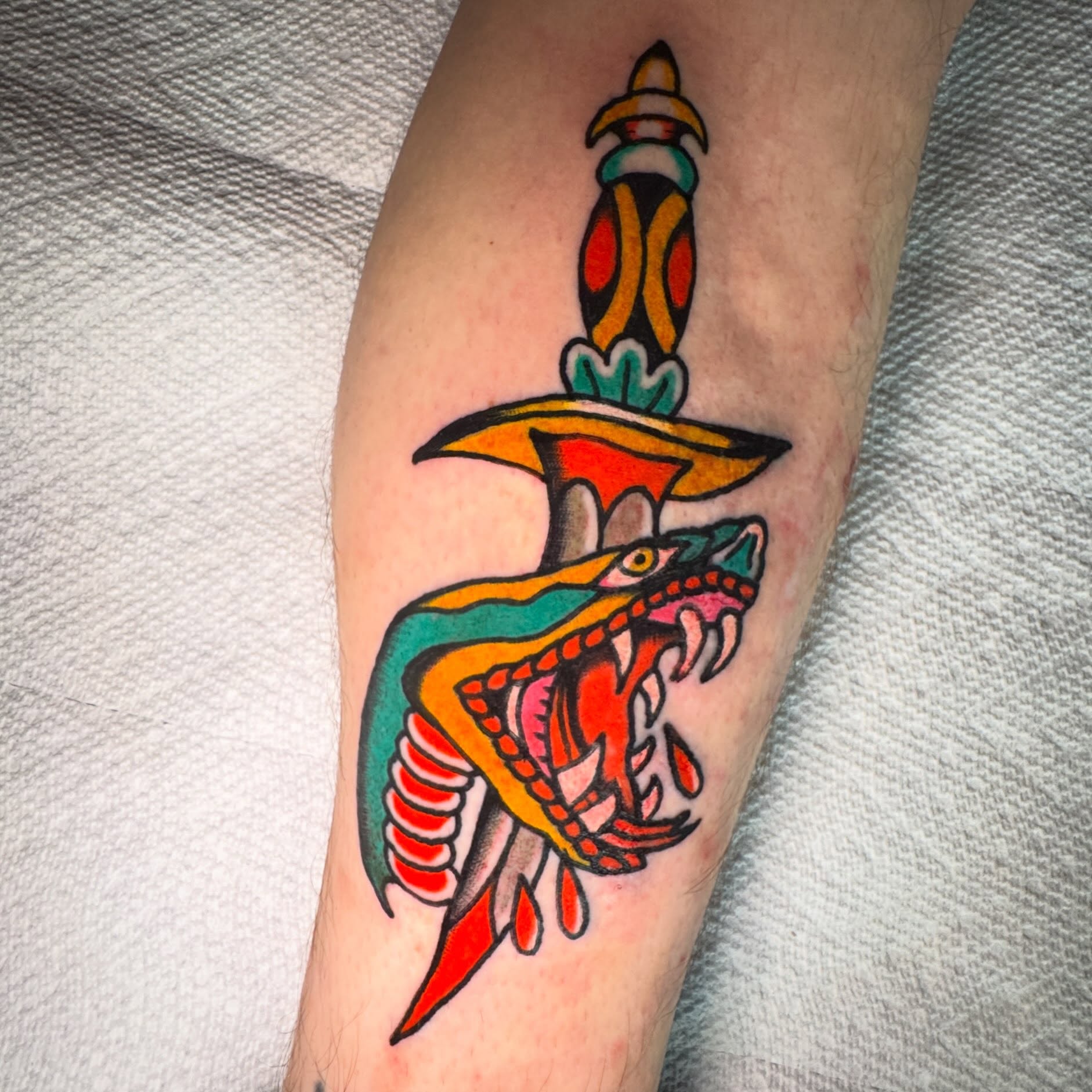 Snake and dagger American traditional tattoo on the forearm by Harrison ♠️