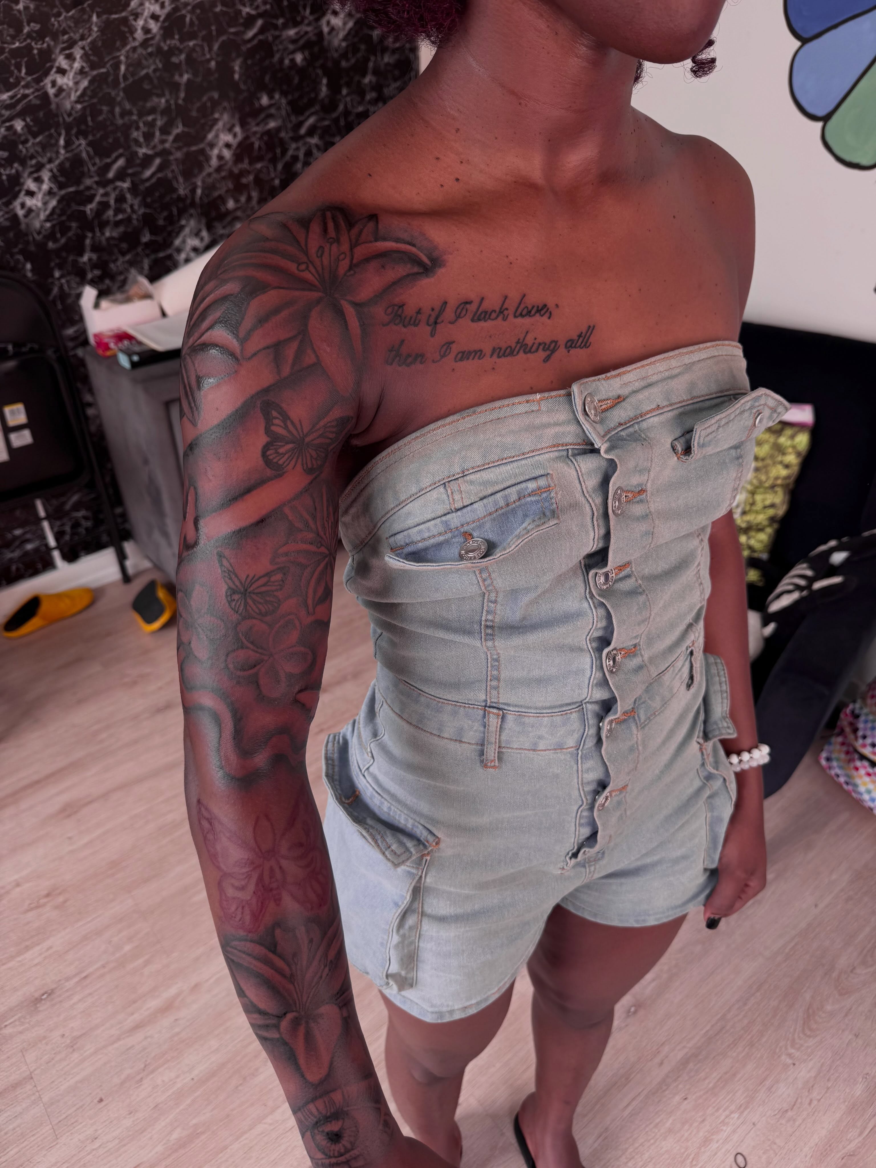 Floral and butterfly black and grey tattoo on the upper arm by inkedbylii, Philadelphia, Pennsylvania