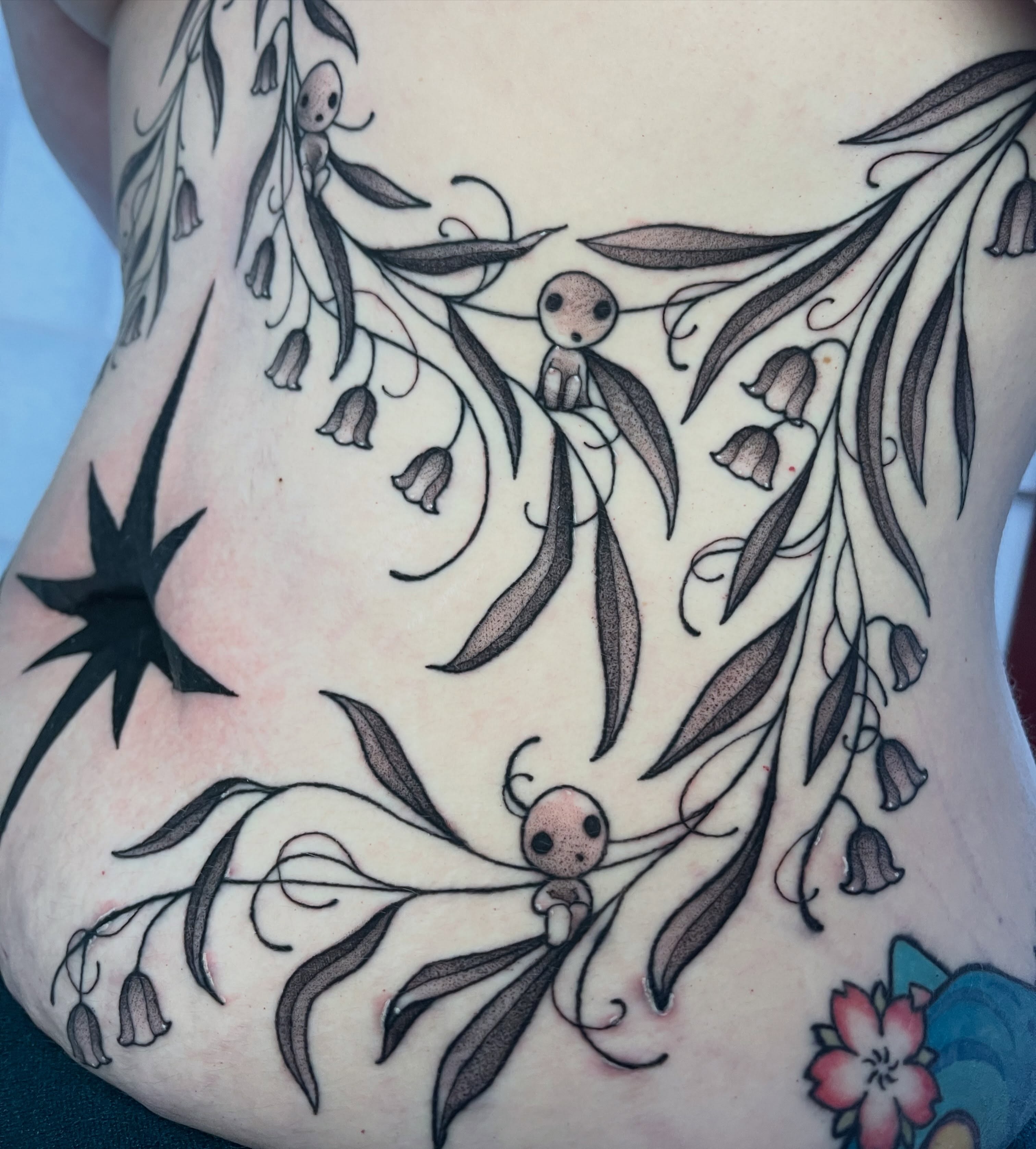 Bellflower and figures black and grey tattoo on the torso by 🌿Izzy🌿