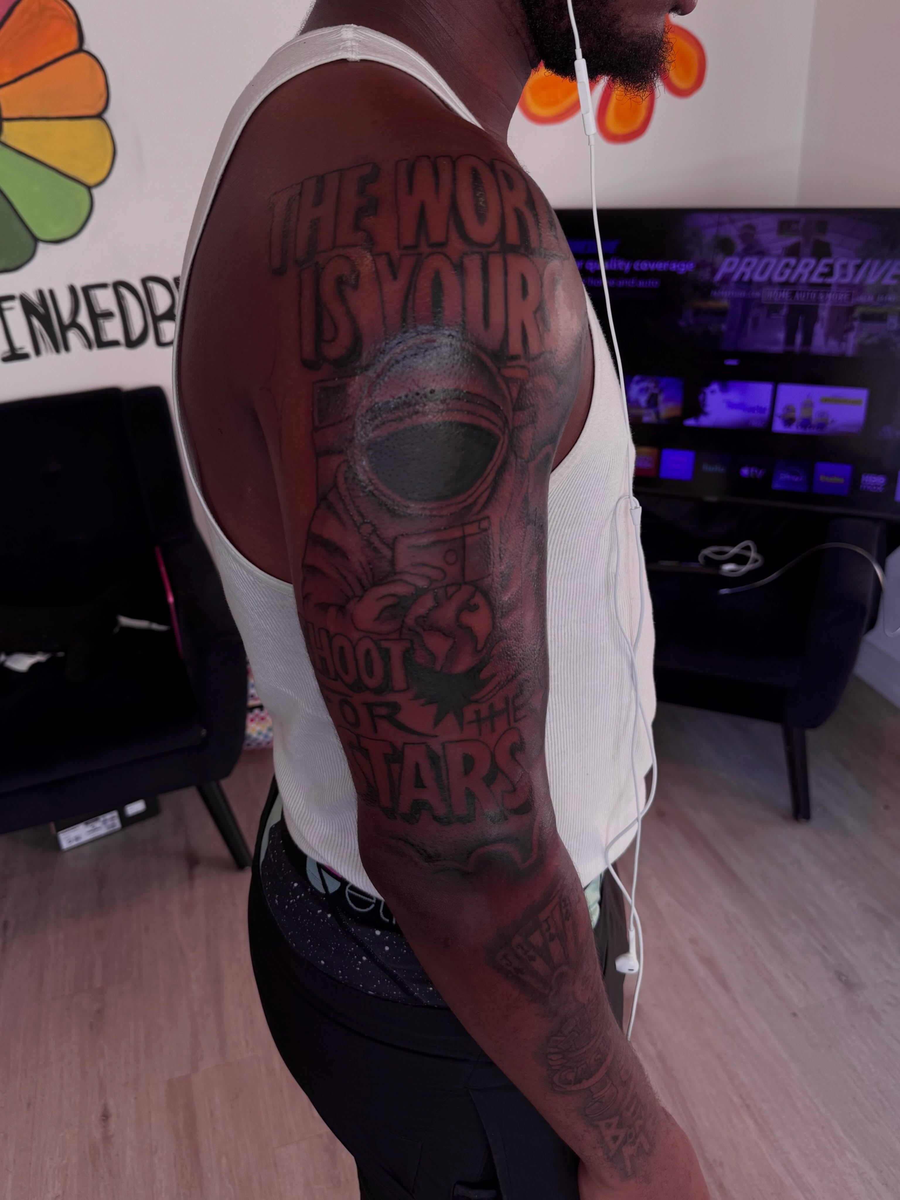 Space helmet black and grey tattoo on the upper arm by inkedbylii, Philadelphia, Pennsylvania