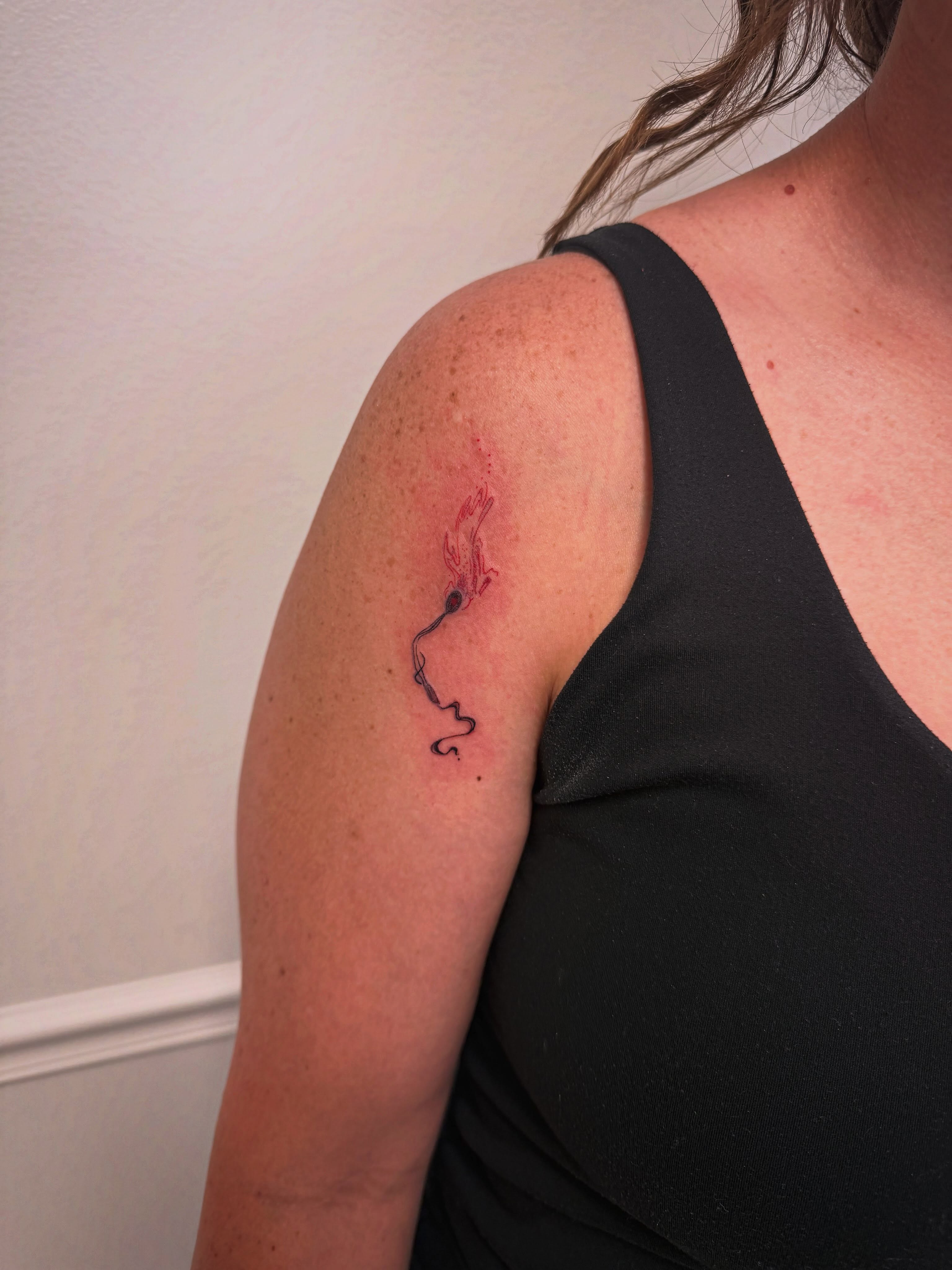 Bird fine line tattoo on the shoulder by Taylor Johnson