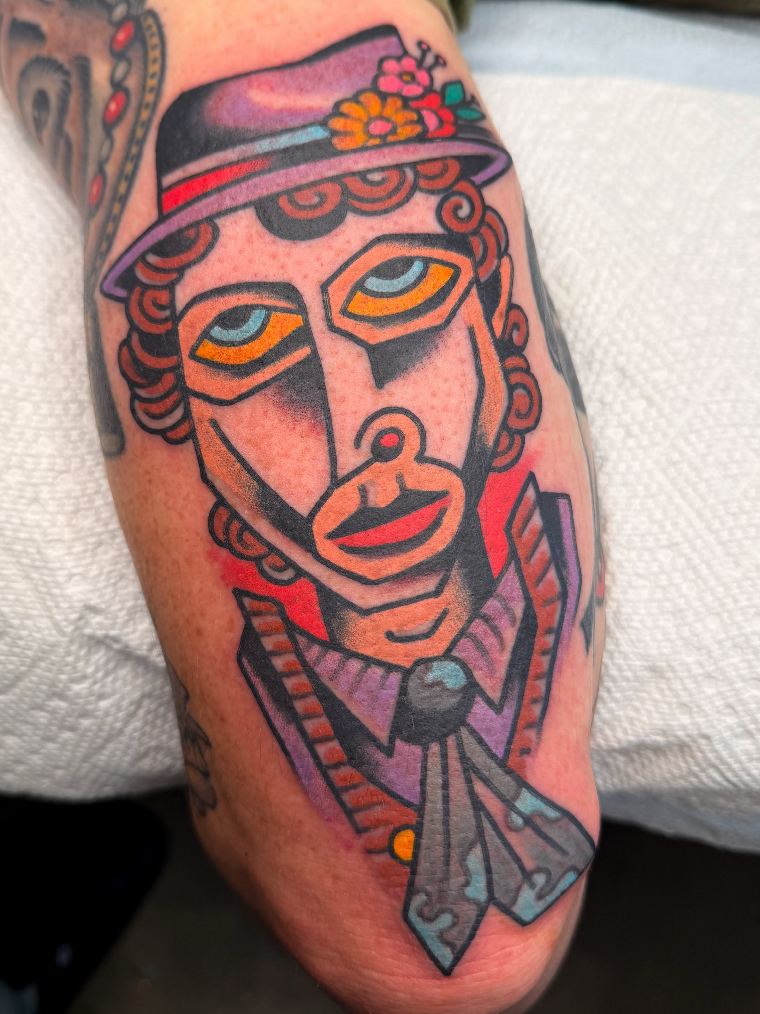 Clown portrait American traditional tattoo on the forearm by Danny Reed, Asheville, North Carolina